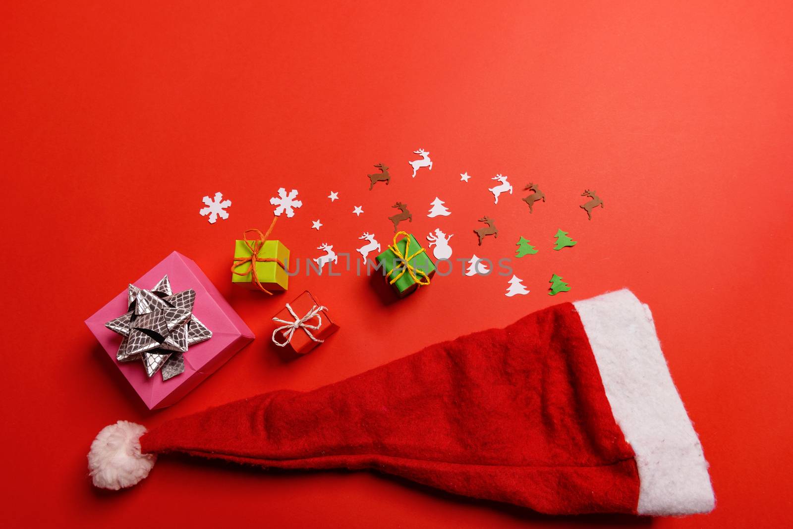 Christmas or New Year background, plain composition made of Xmas decorations and fir branches, flat lay, blank space for a greeting text.