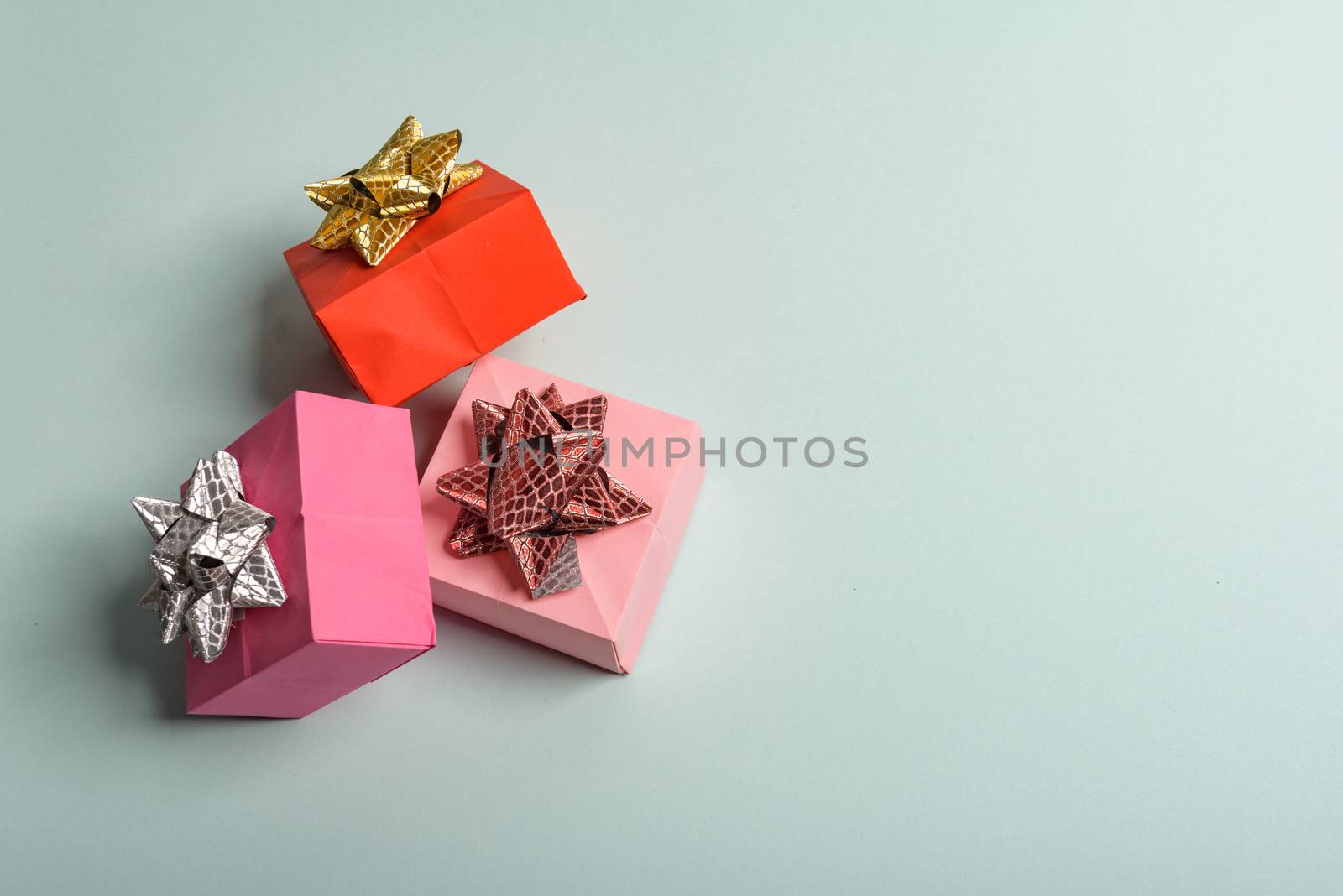 christmas presents nicely decorated with bows and feathers. view from above. Reindeers.