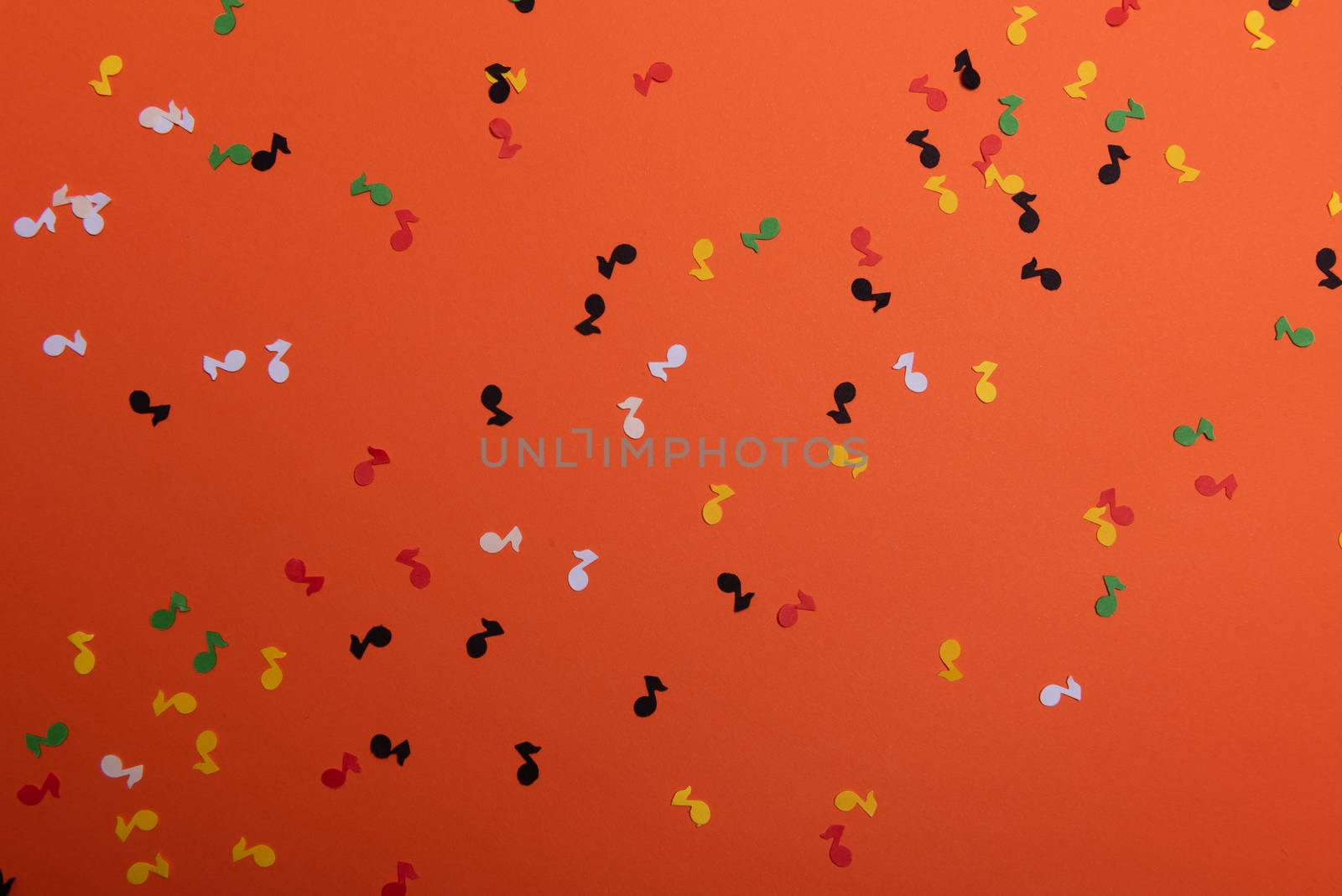 Paper colorful music notes background. View above.