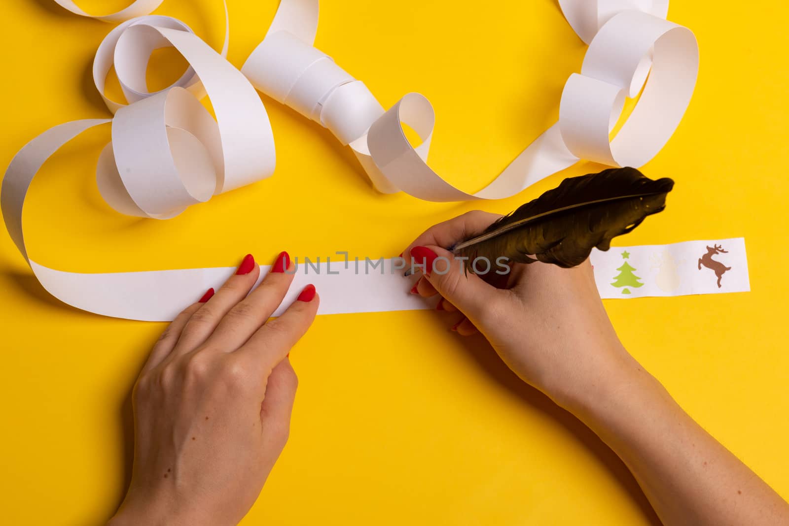 Long twisted expanded letter for Santa Claus. Copy space. yellow background
