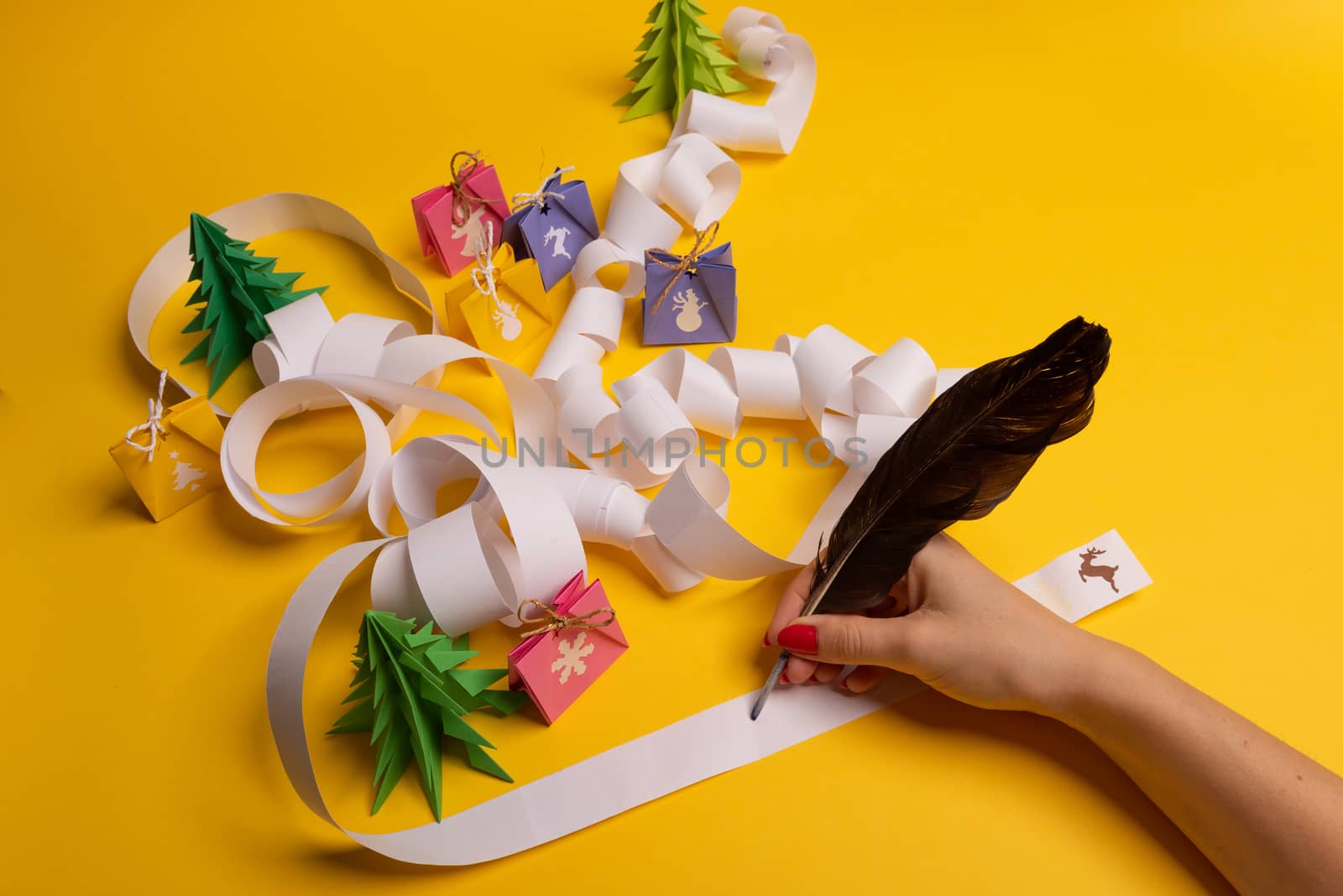 Long twisted expanded letter for Santa Claus. Copy space. yellow background