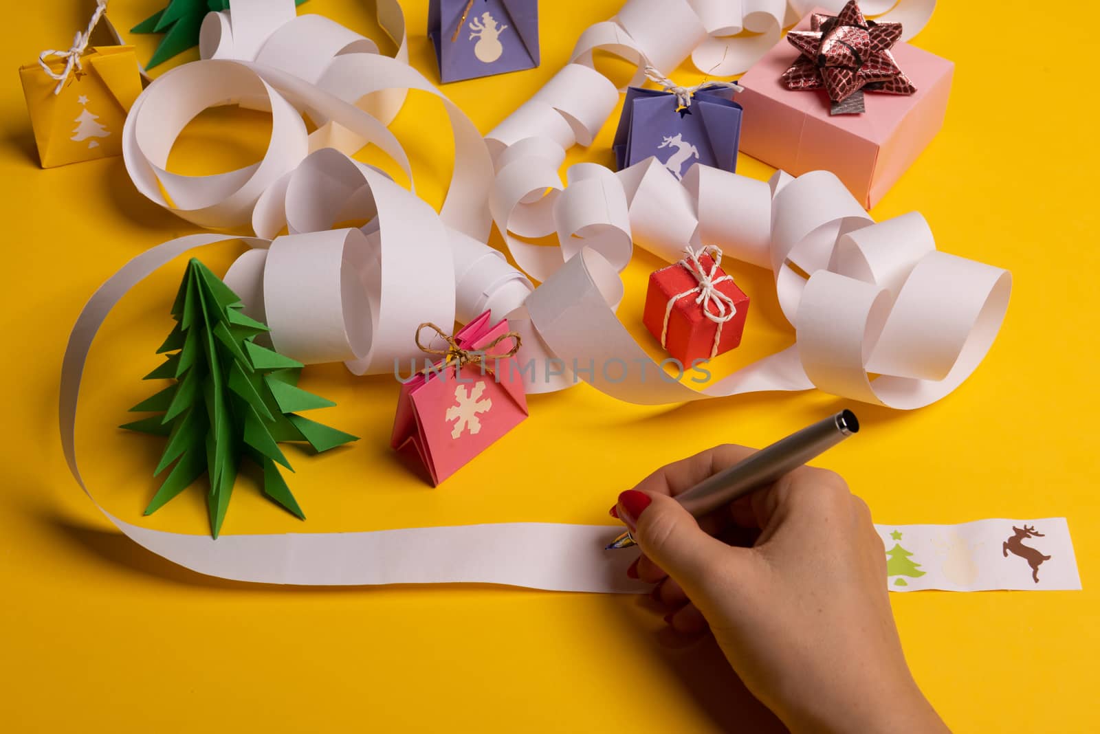 Long twisted expanded letter for Santa Claus. Copy space. yellow background