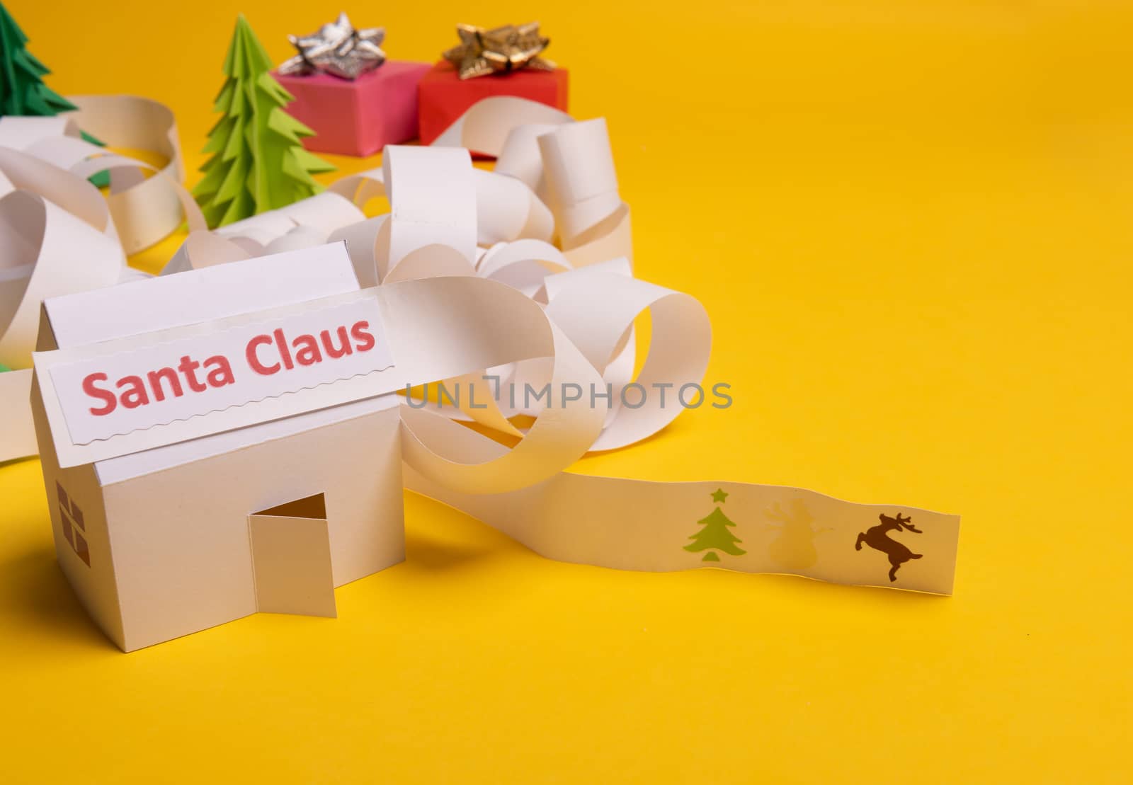Long twisted expanded letter for Santa Claus. Copy space. yellow background