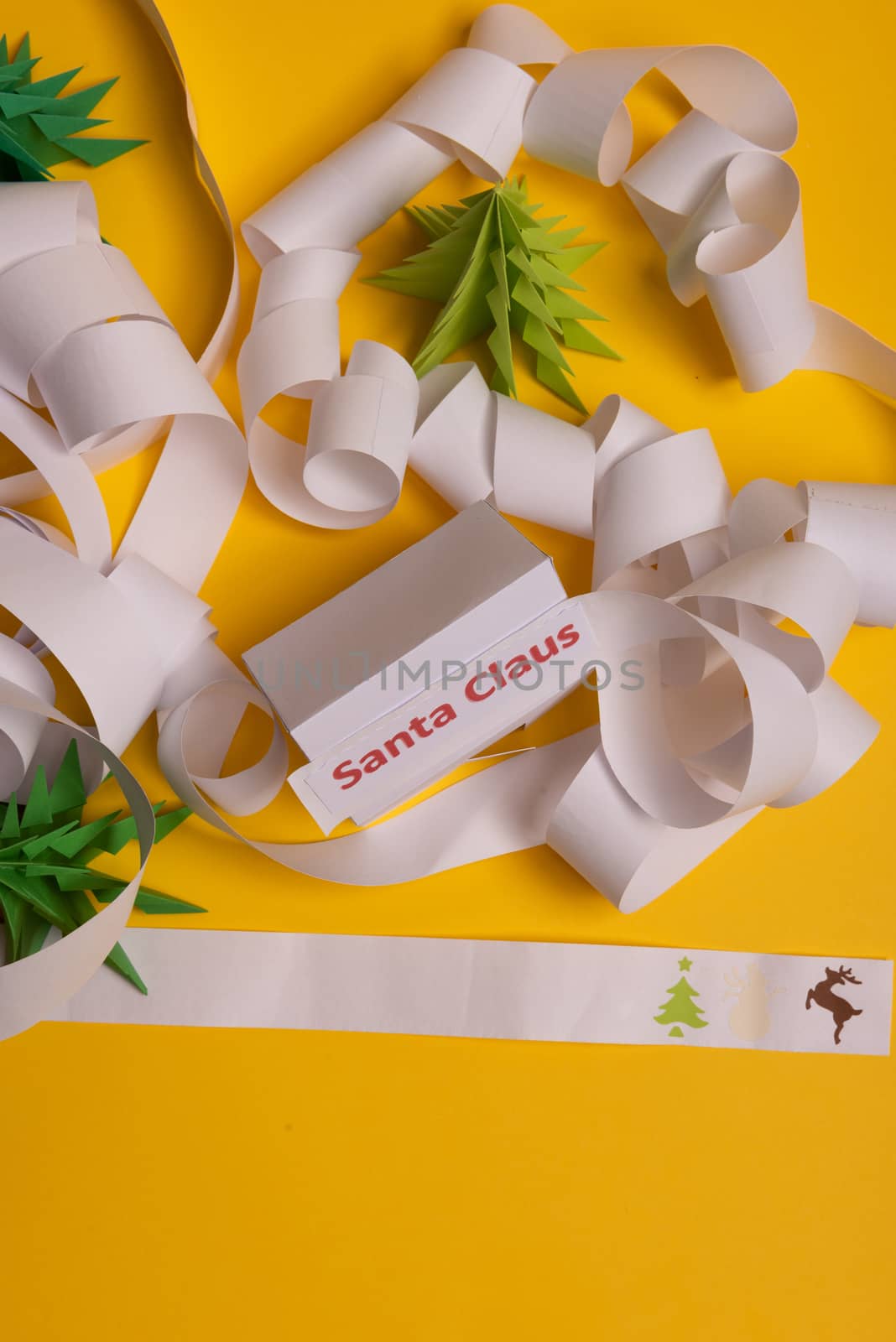 Long twisted expanded letter for Santa Claus. Copy space. yellow background