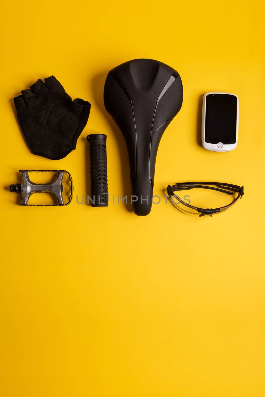 Bicycle, Cycling accessories on the yellow background. view from above