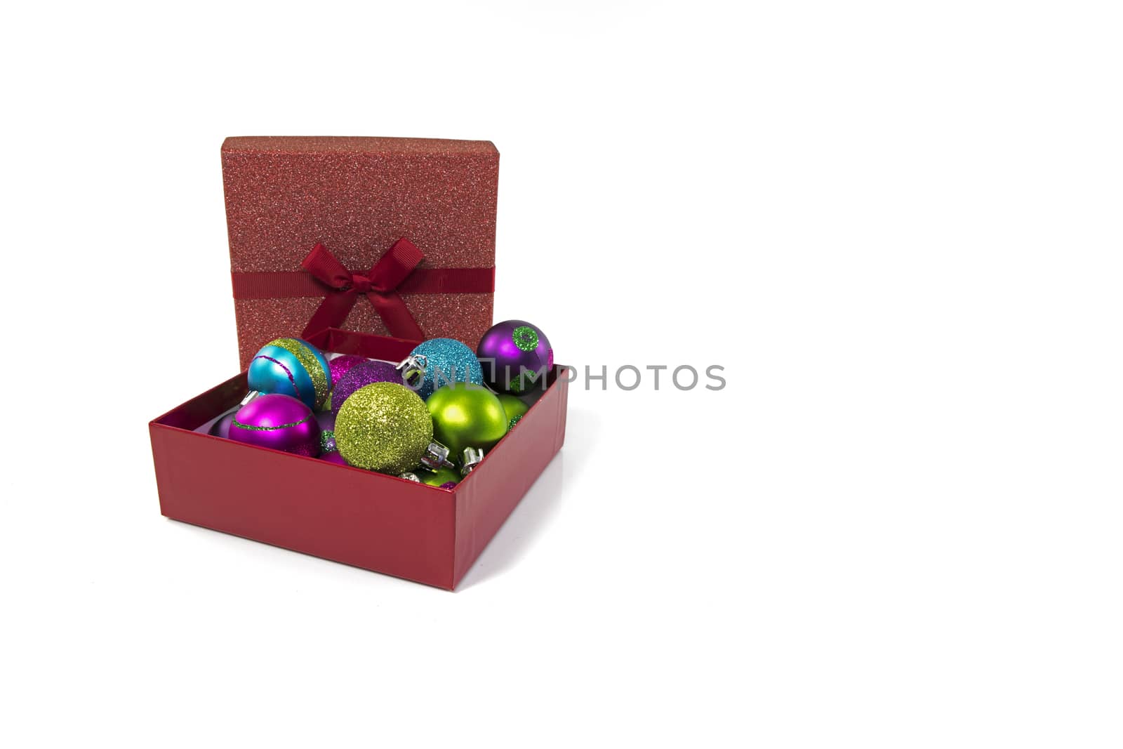 gift boxes in red with christmas balls by compuinfoto