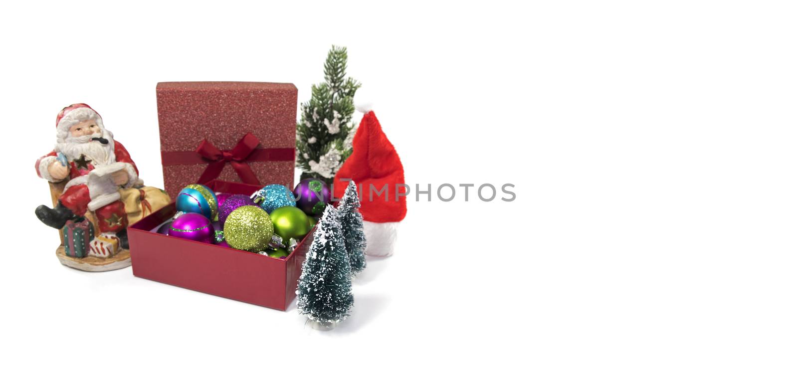 santa claus and a box with christmas balls  by compuinfoto