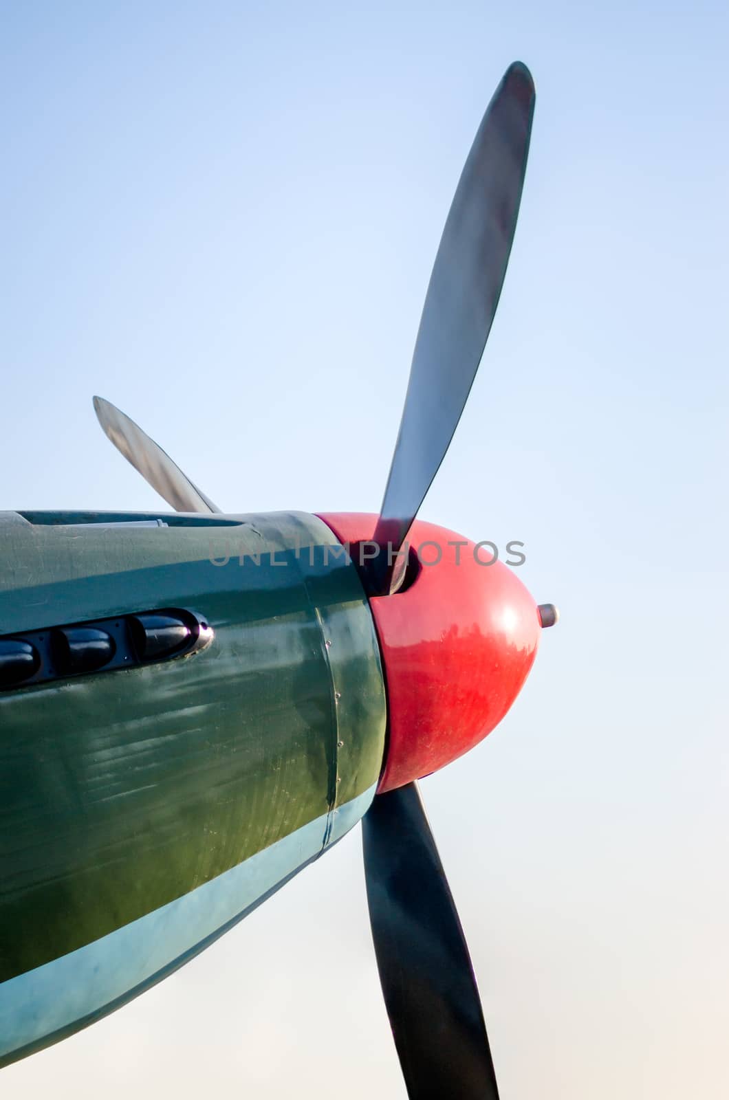 propeller blades of an old vintage airplane on a blue sky background close up