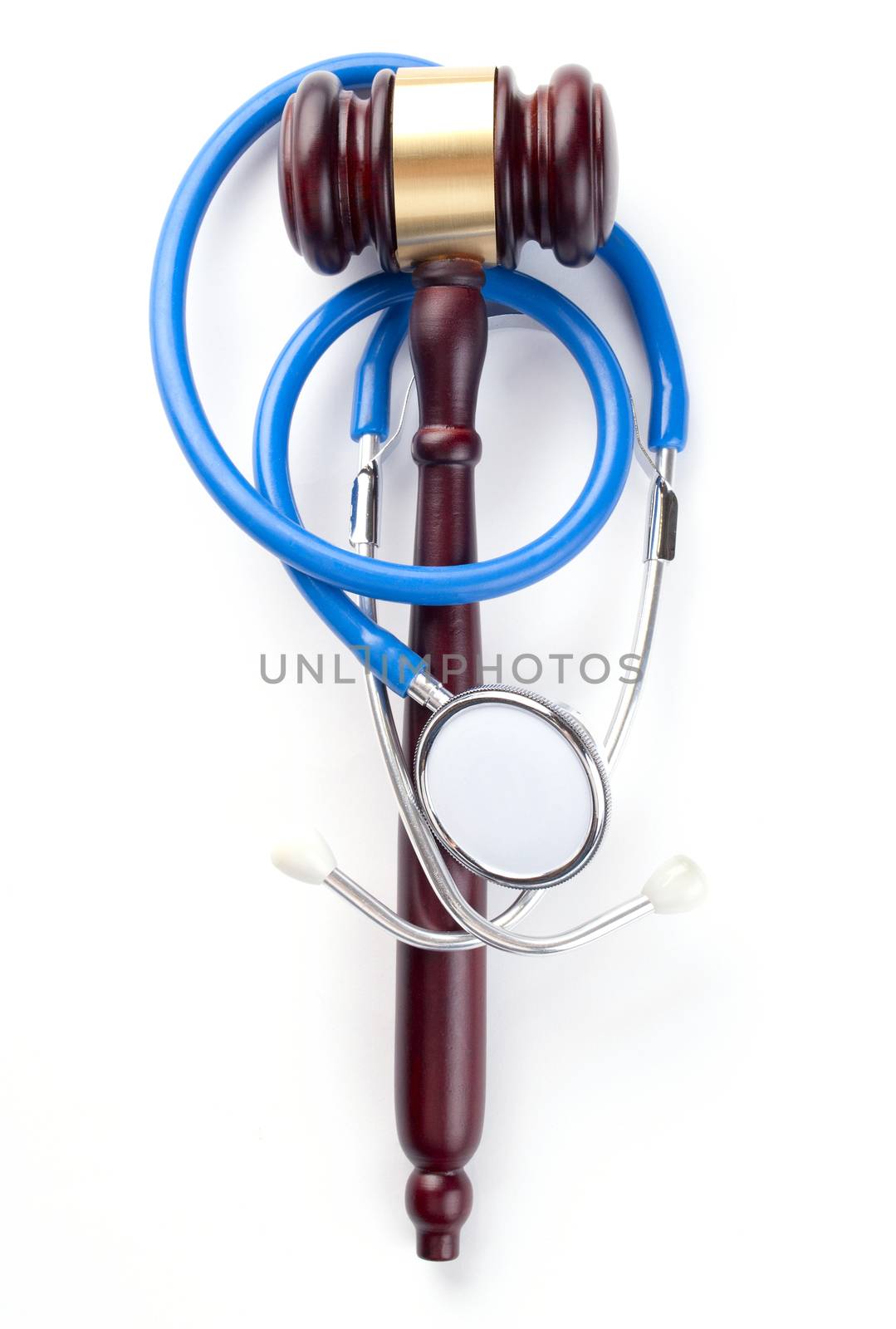 brown gavel and a medical stethoscope on white background