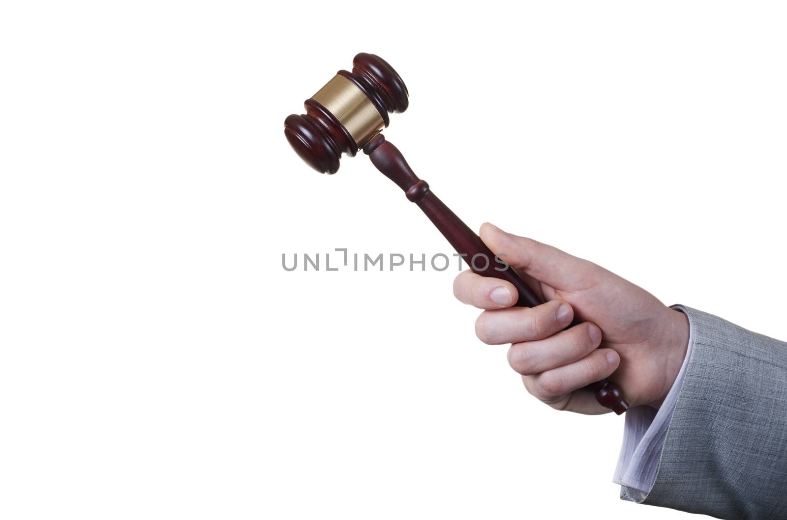 gavel in the hand of a man in a business suit