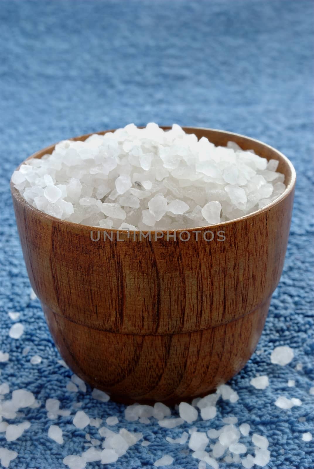 sea ​​salt in wooden bowl on a towel by sergii_gnatiuk