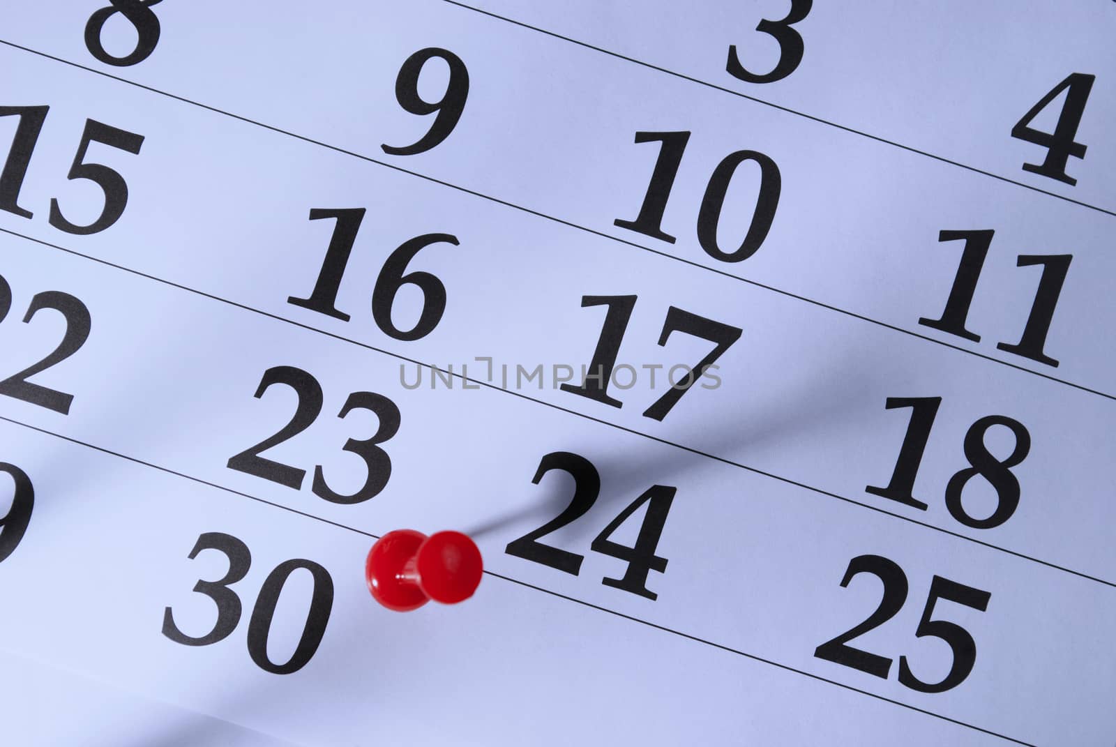 Calendar and pushpin on the fifteenth
