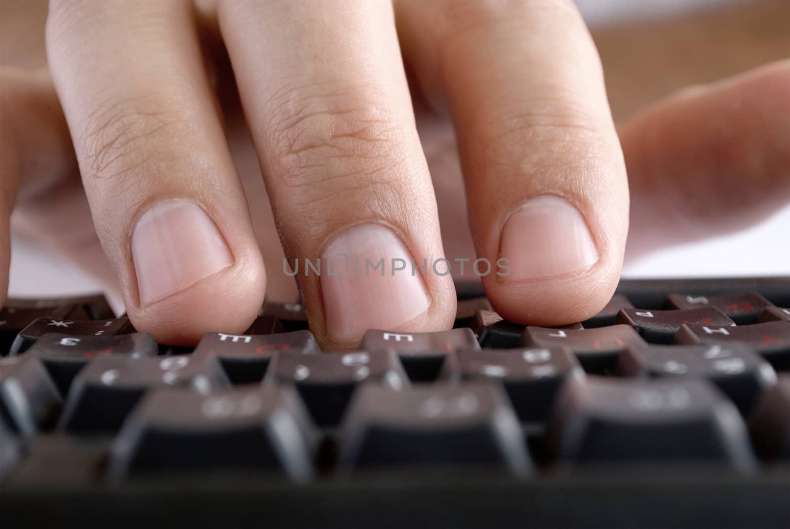 man's hand on computer keyboard woman's hand on the keyboard typing