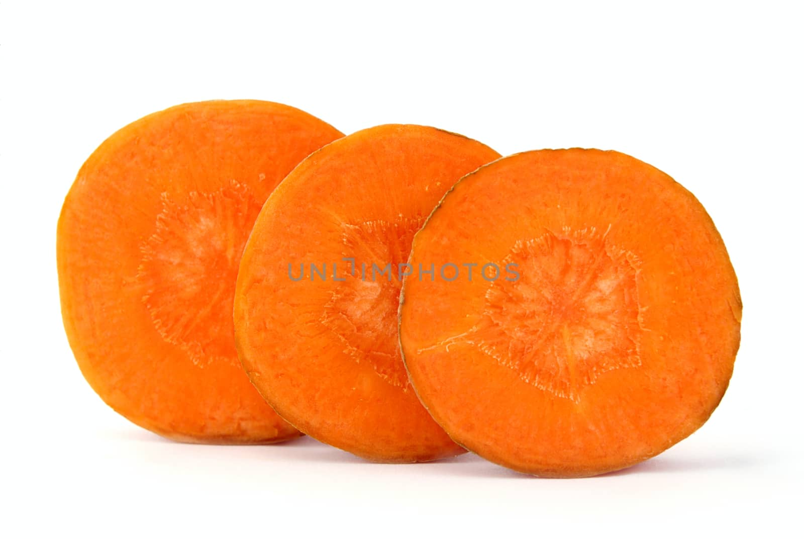 Carrot is cut by rings on a white background