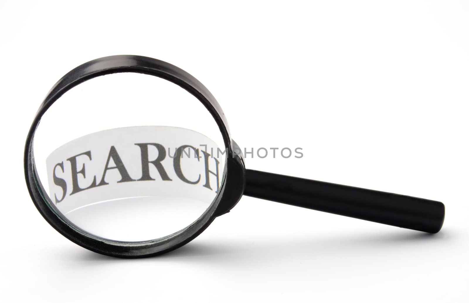 Magnifier and piece of paper with an inscription search