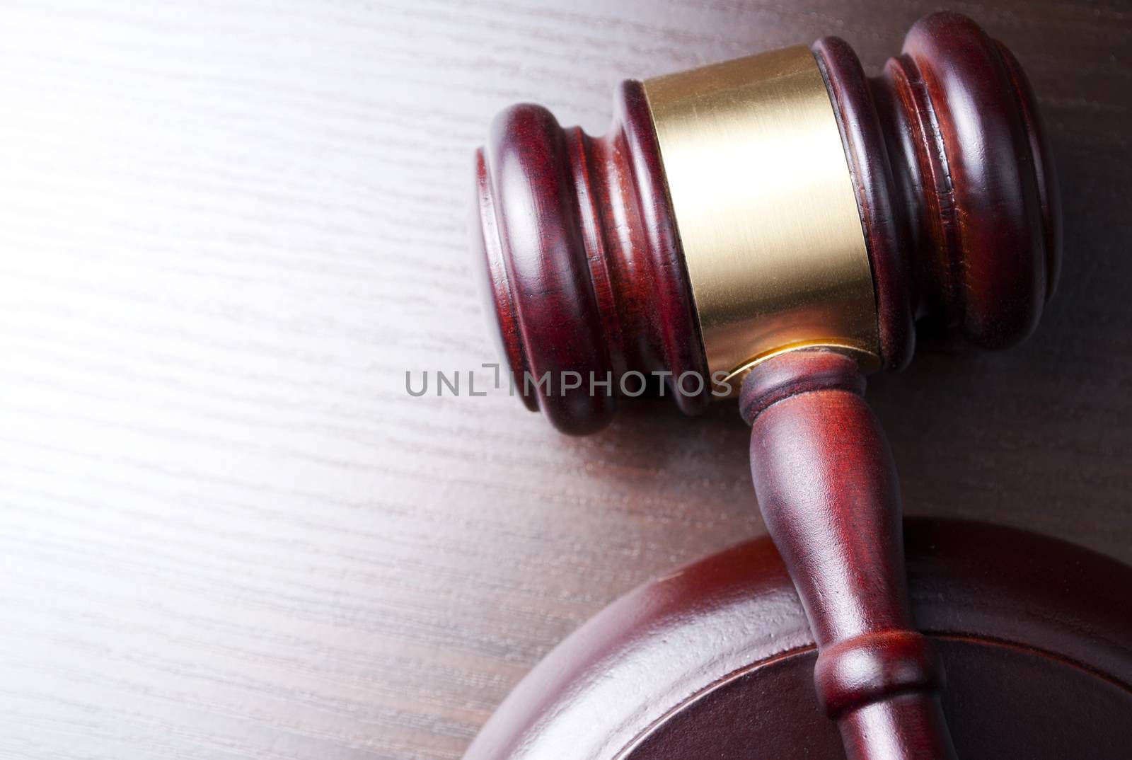 brown gavel on the table and shot with shallow depth of field