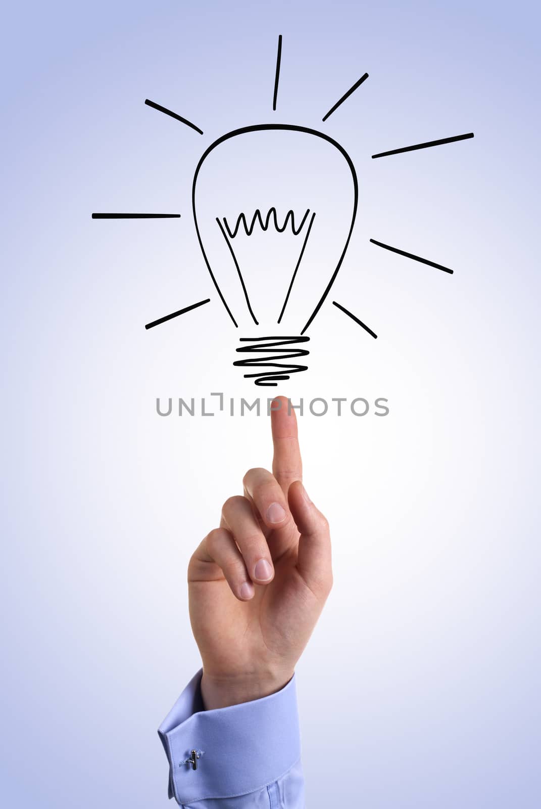 Businessman points finger at the light bulb
