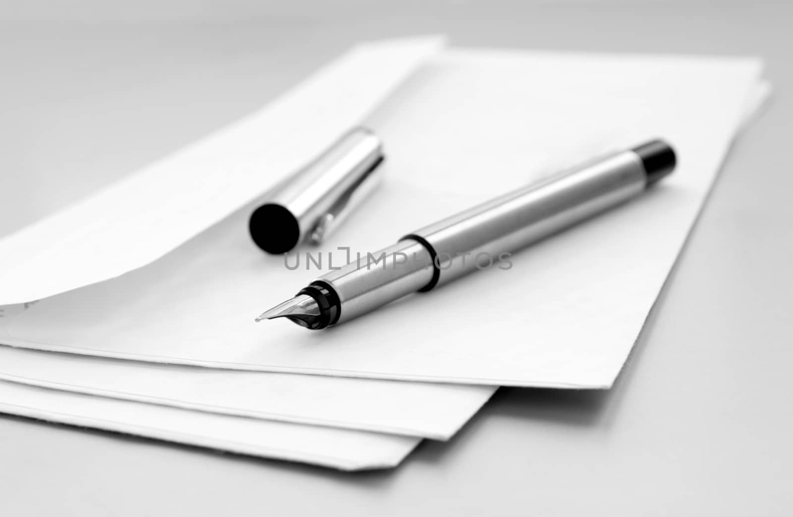 mailing envelope and pen on the table