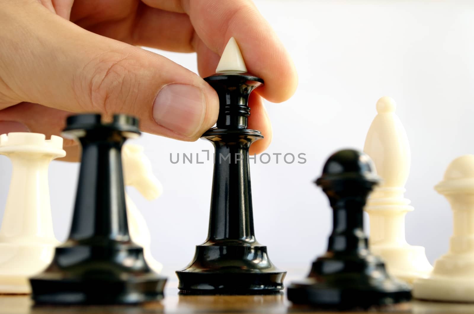 man playing chess by sergii_gnatiuk