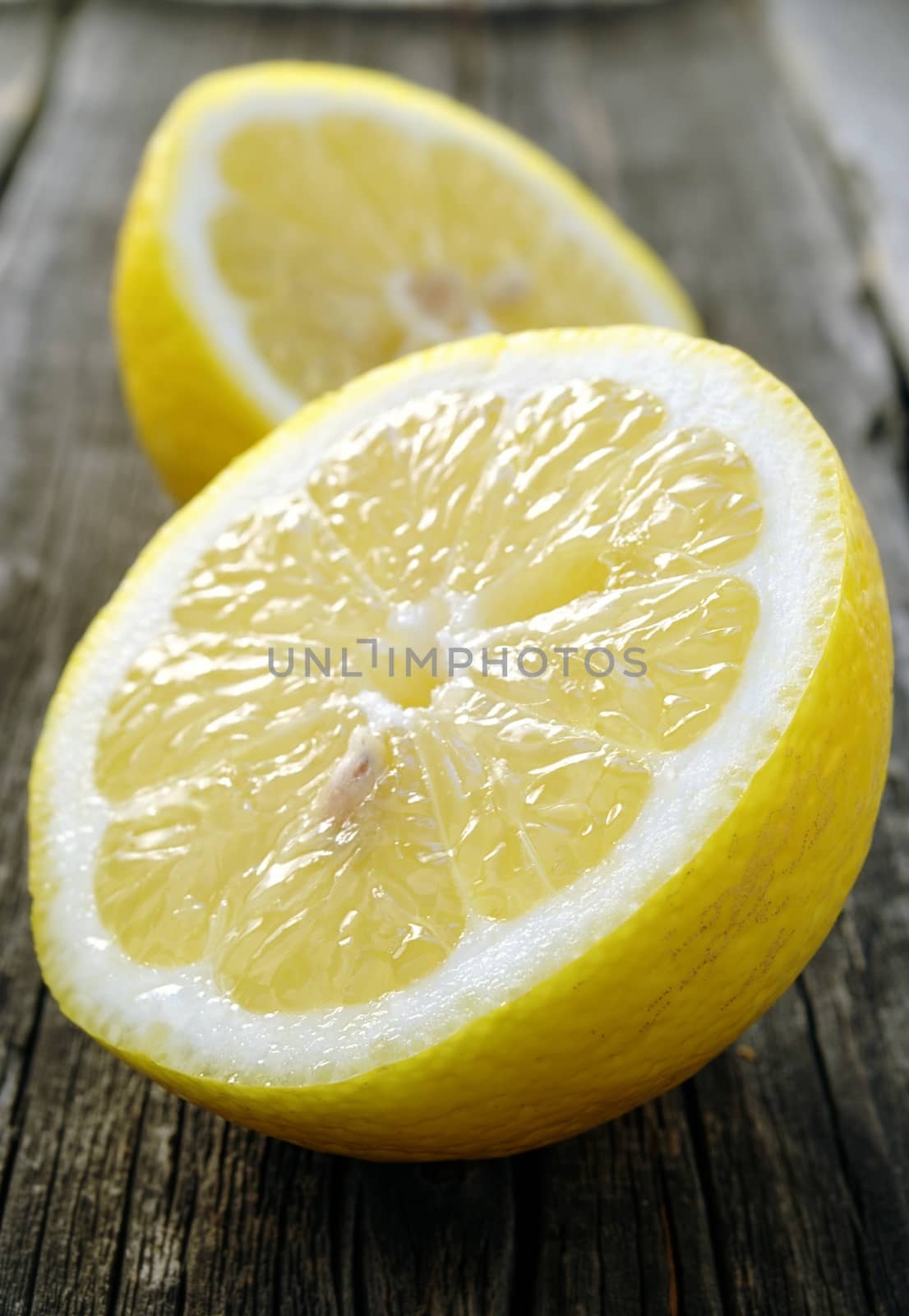 cut a lemon in an old dark board