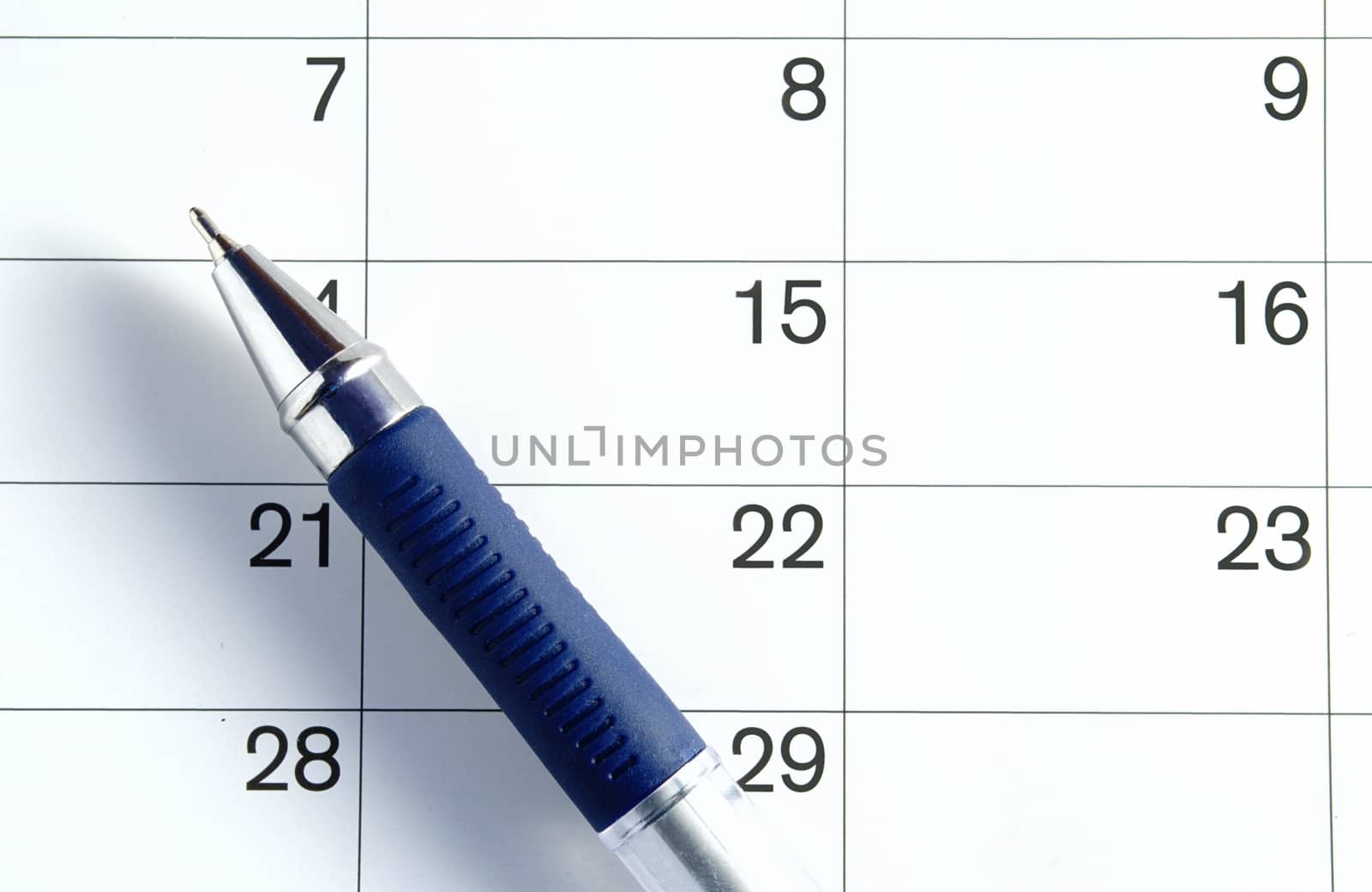 ballpoint pen on the page is a calendar to mark the date