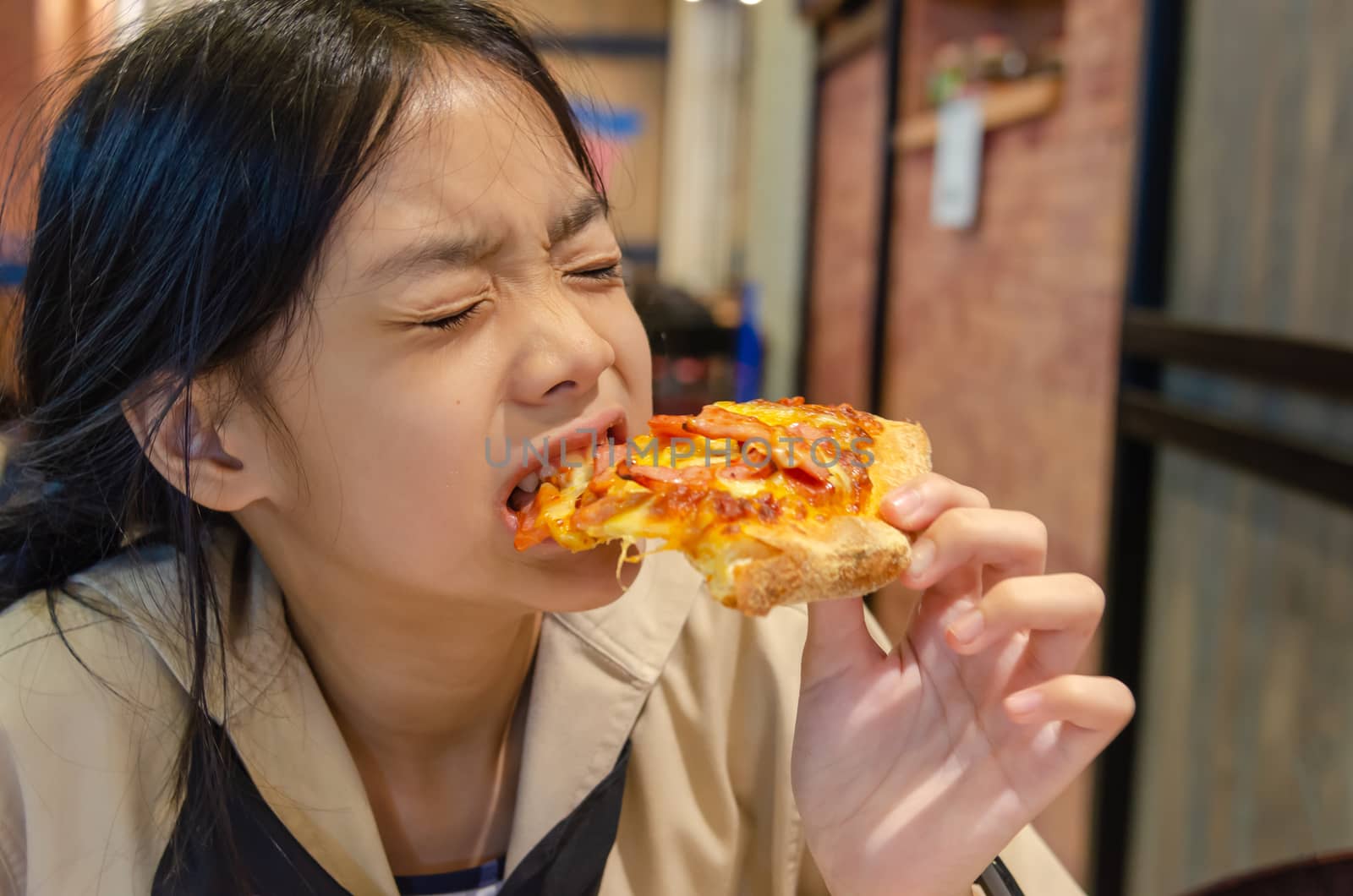 Asian children eat pizza by aoo3771