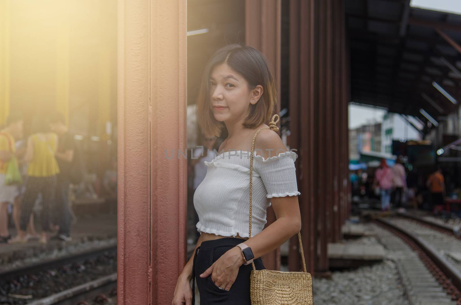 lifestyle fashion portrait woman asian at the train.