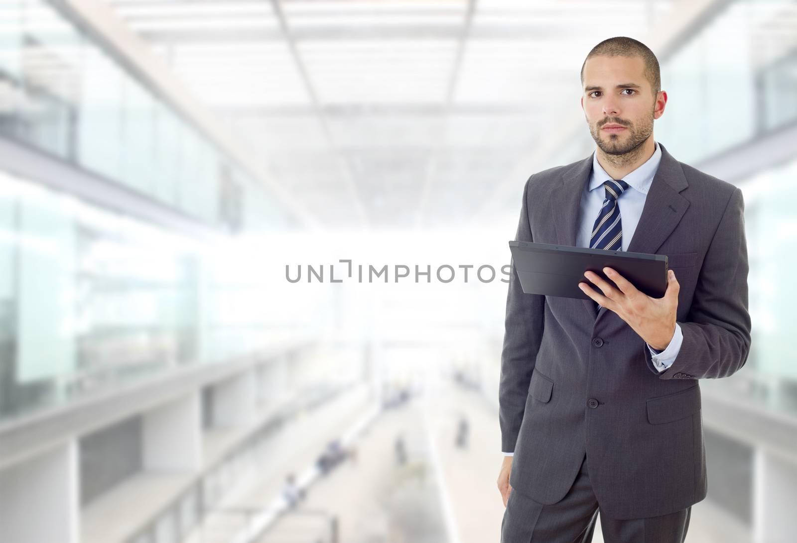 worried businessman working with a tablet pc, at the office