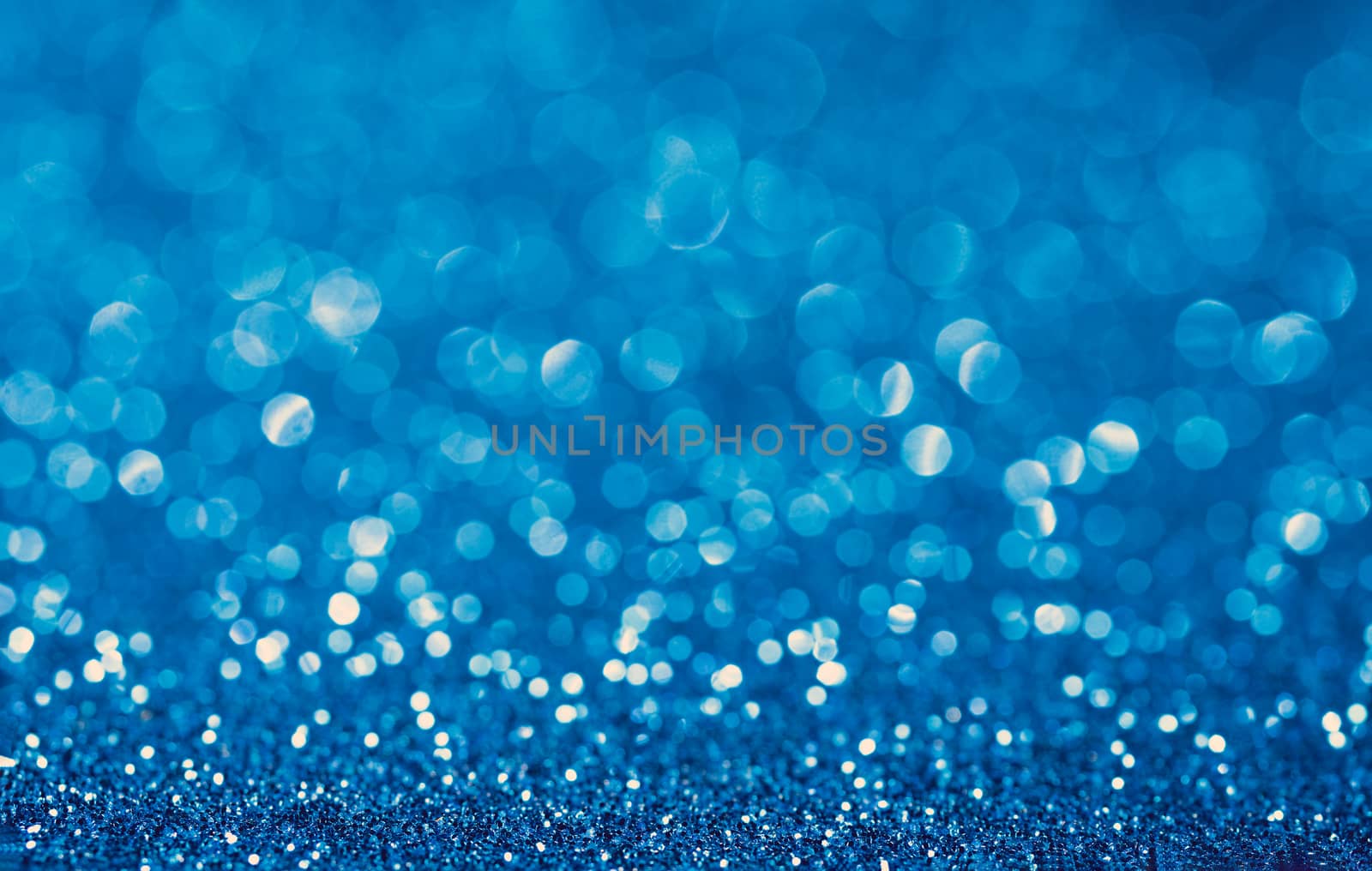 Blue shiny festive christmas background. Beautiful bokeh.