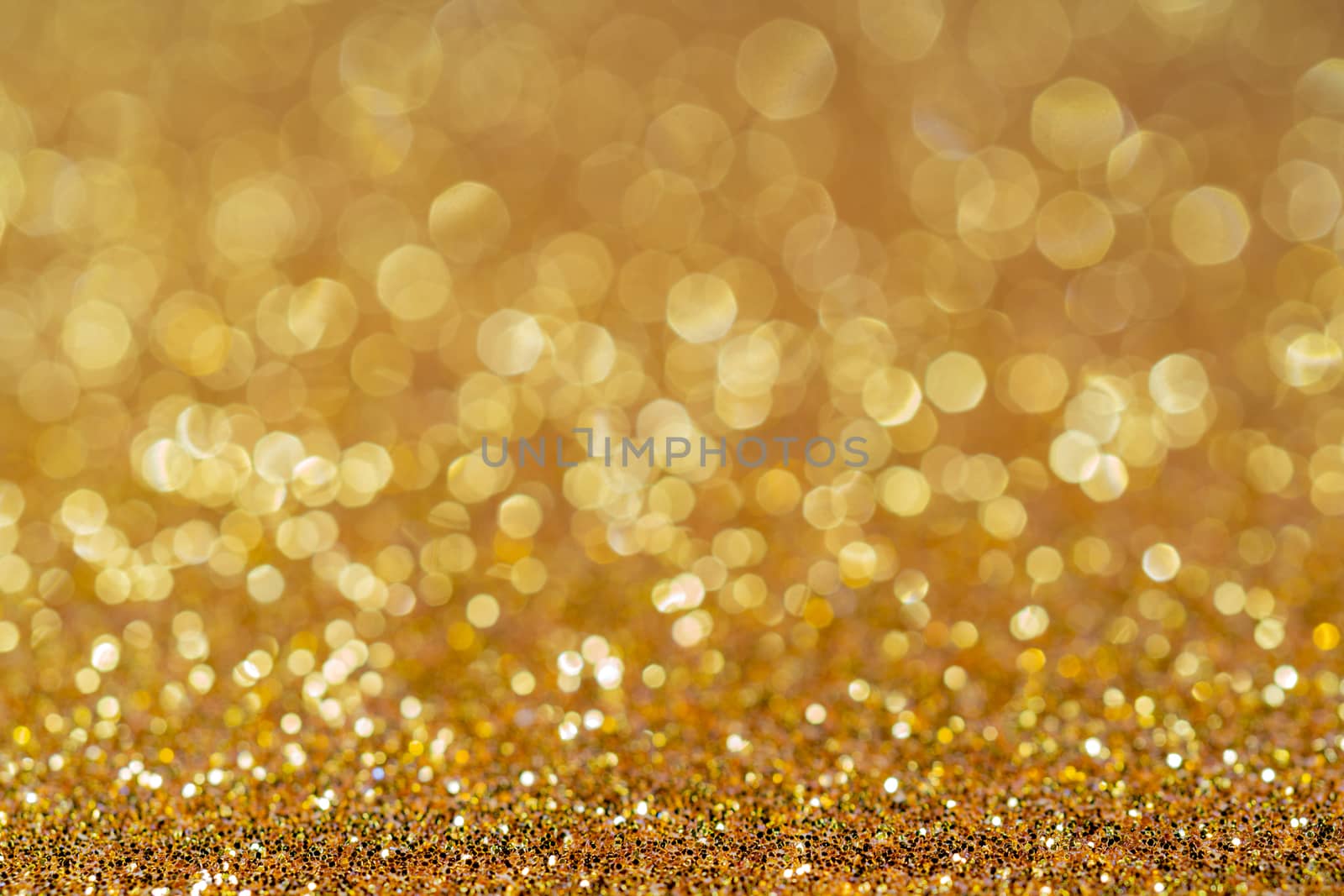 Golden shiny festive christmas background. Beautiful bokeh.