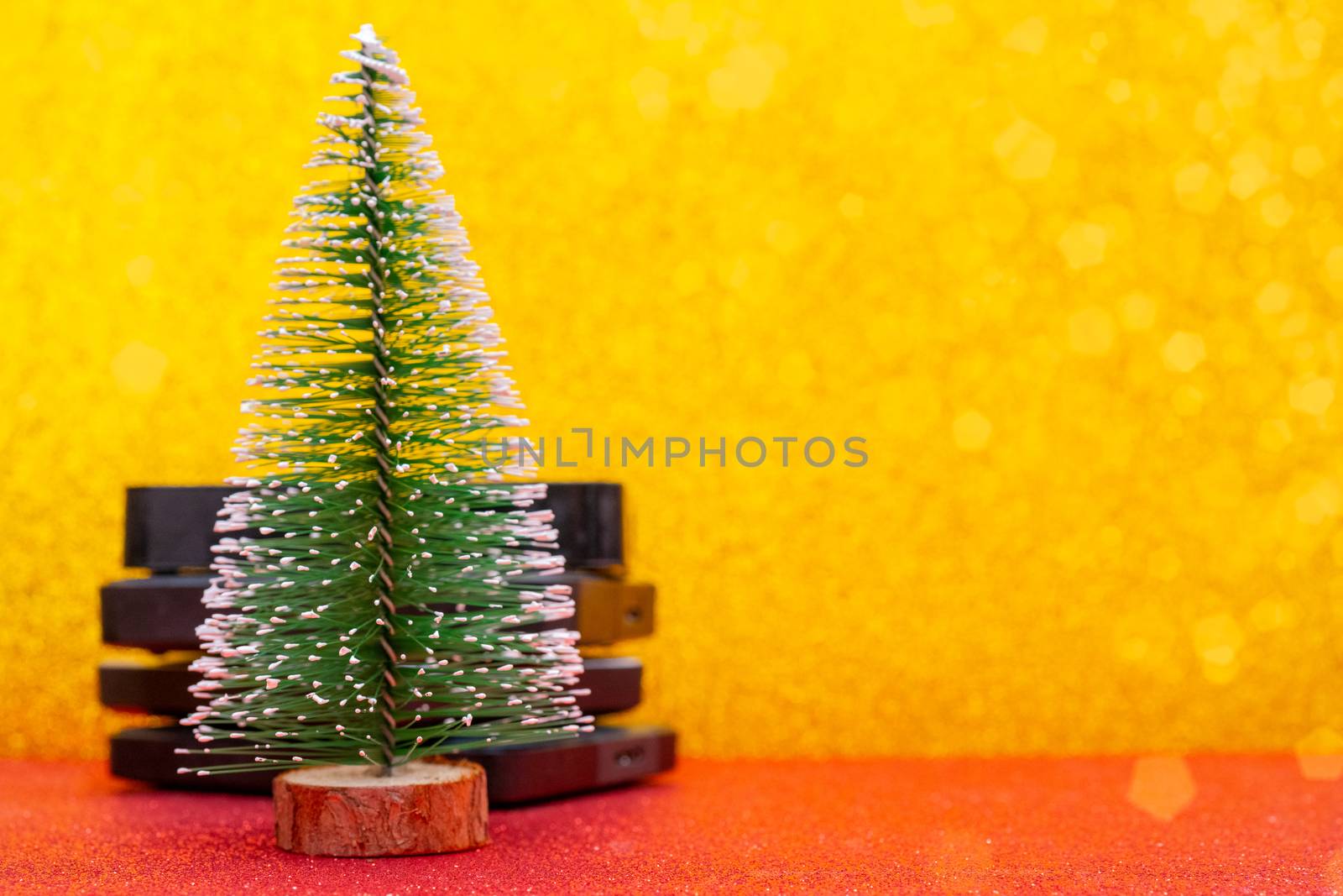 Festive Christmas tree and computer hard drives for data storage.