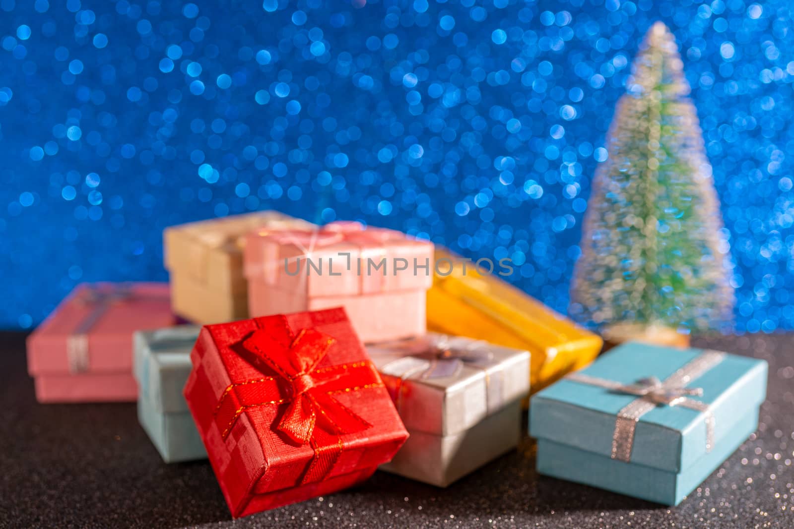 Christmas tree and gift box. Festive christmas background.