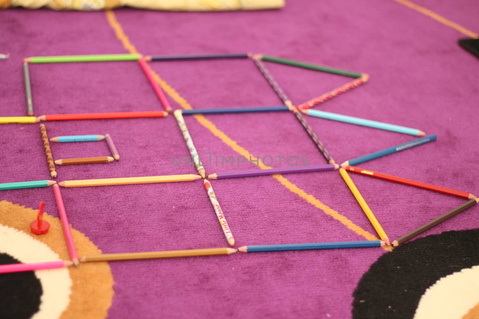 pencil color object on purple carpet