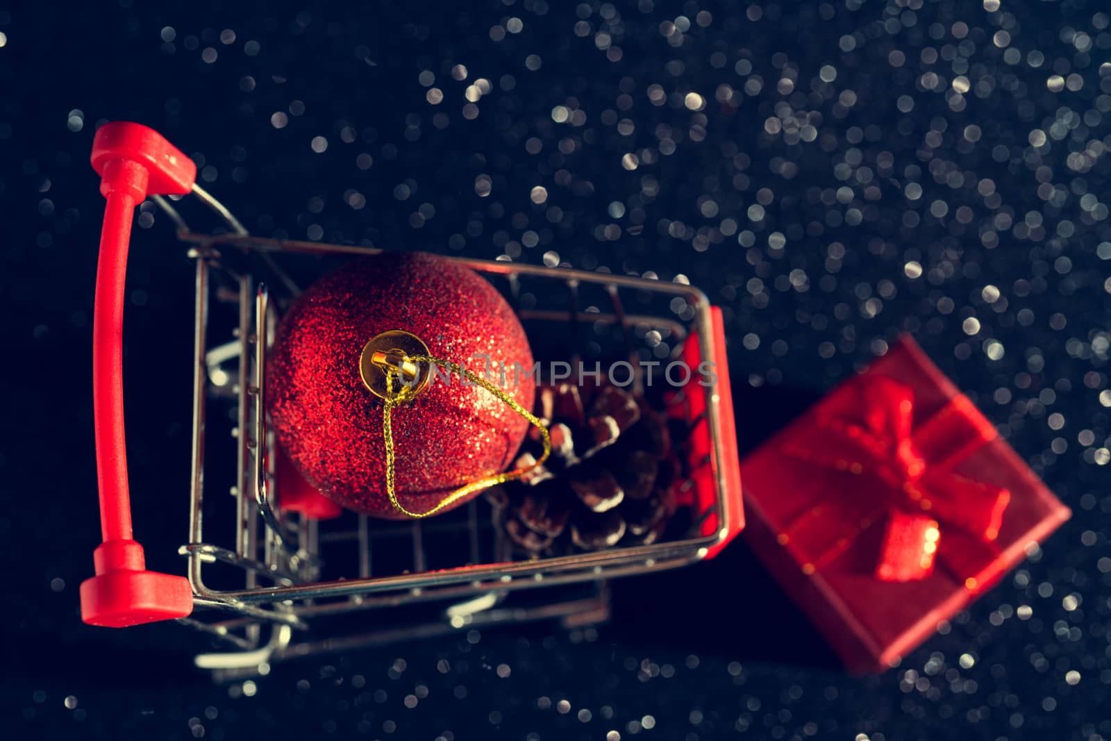Christmas toys and gifts on a shiny dark background.