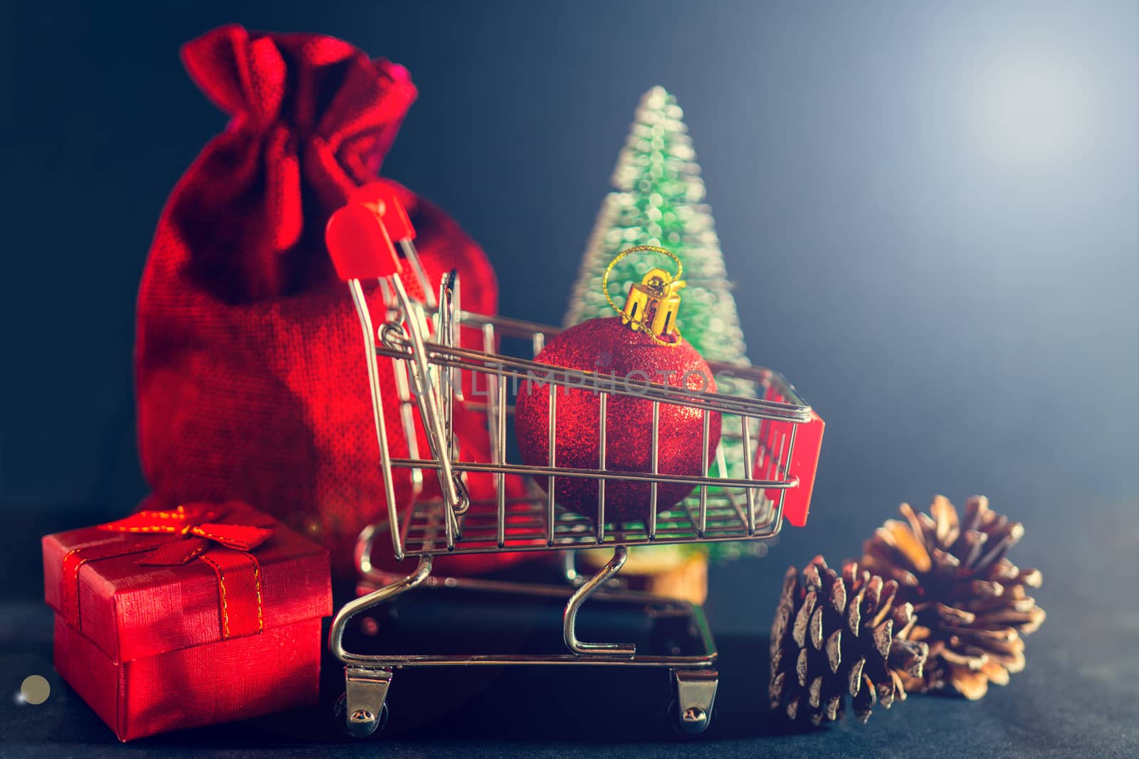 Christmas toys and gifts on a shiny dark background.