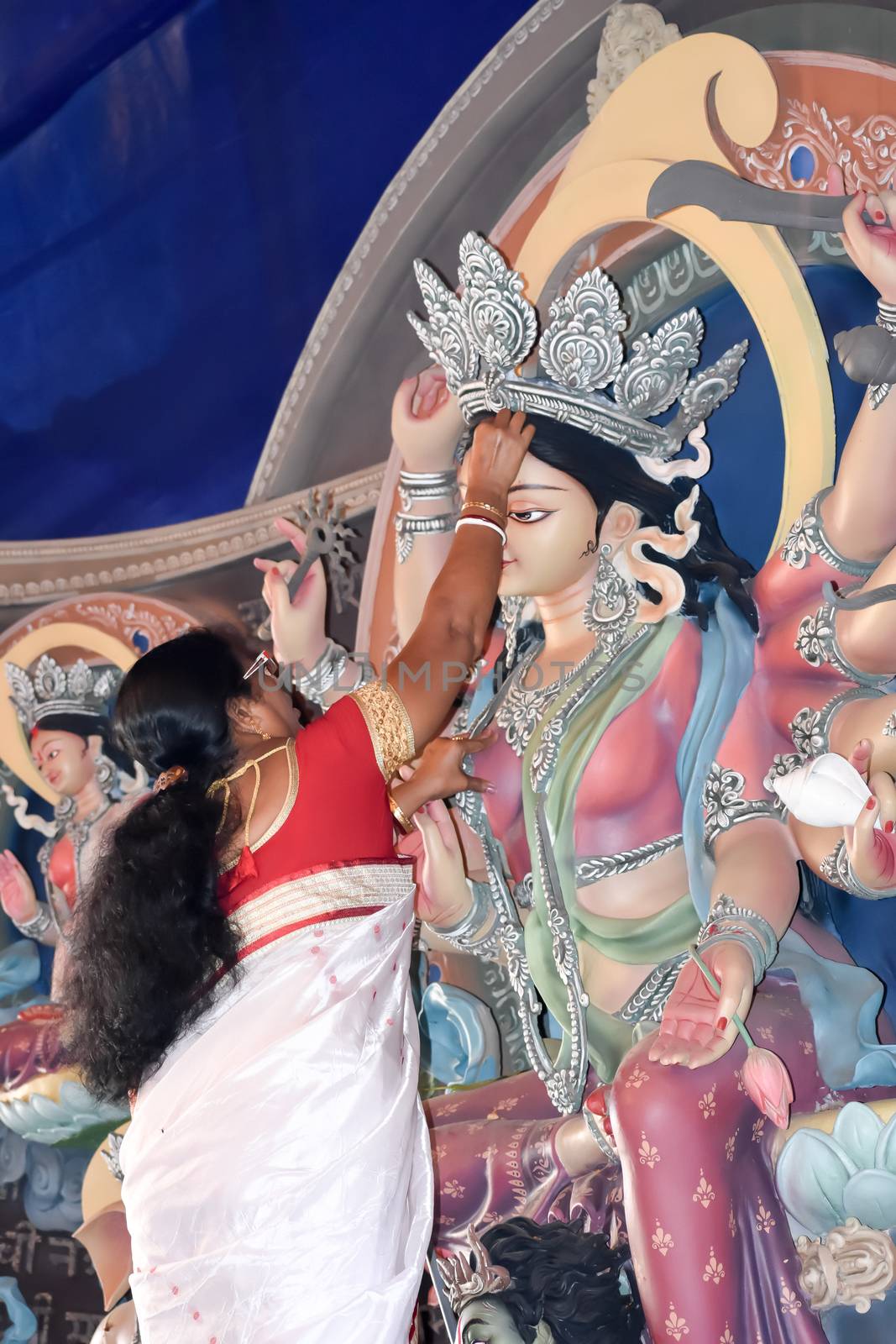 Kolkata October 2019 - Maa Durga Debi boron is done by a Hindu devotee at Vijaya Dashami, the last day of Durga puja Festival. Sindoor Khela is a bidding adieu ritual to bid farewell to the deity.