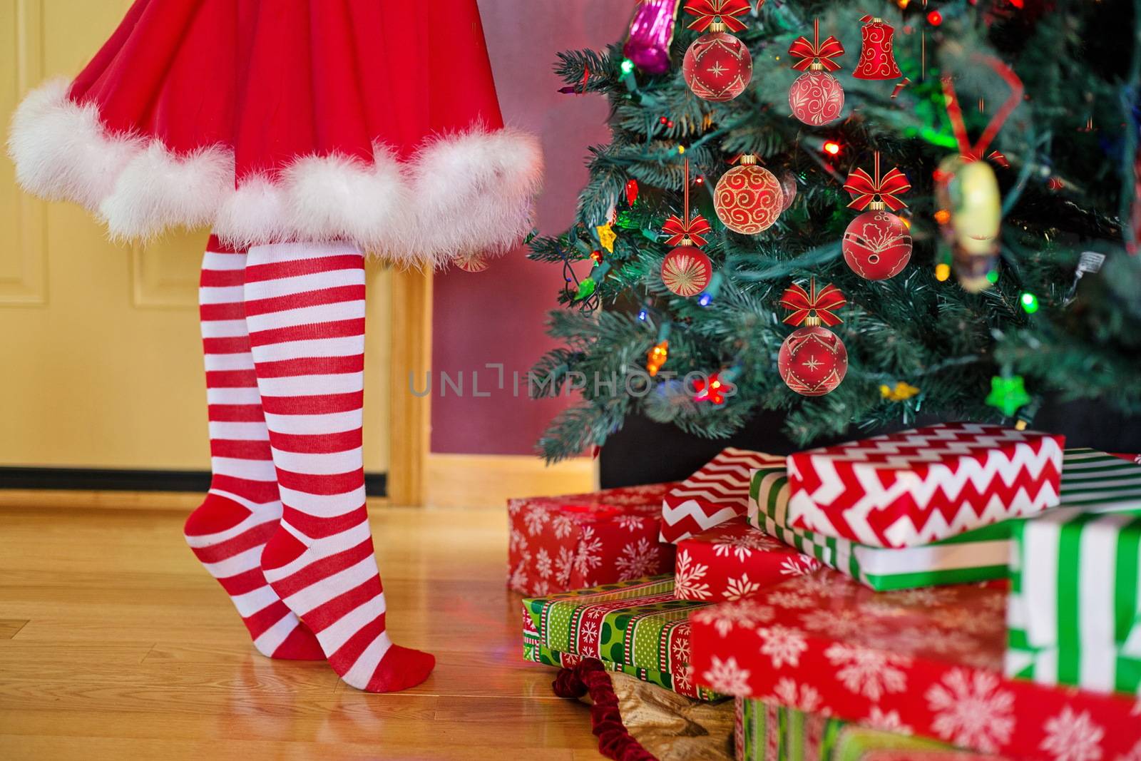 In images Christmas characters snow maiden. Girl in a Christmas costume decorates the Christmas tree