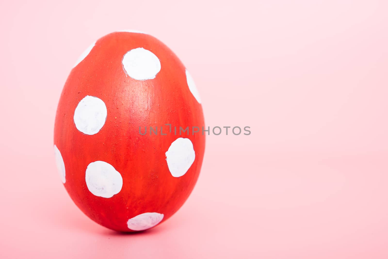 Beautiful Easter red egg color on pink background by Sorapop