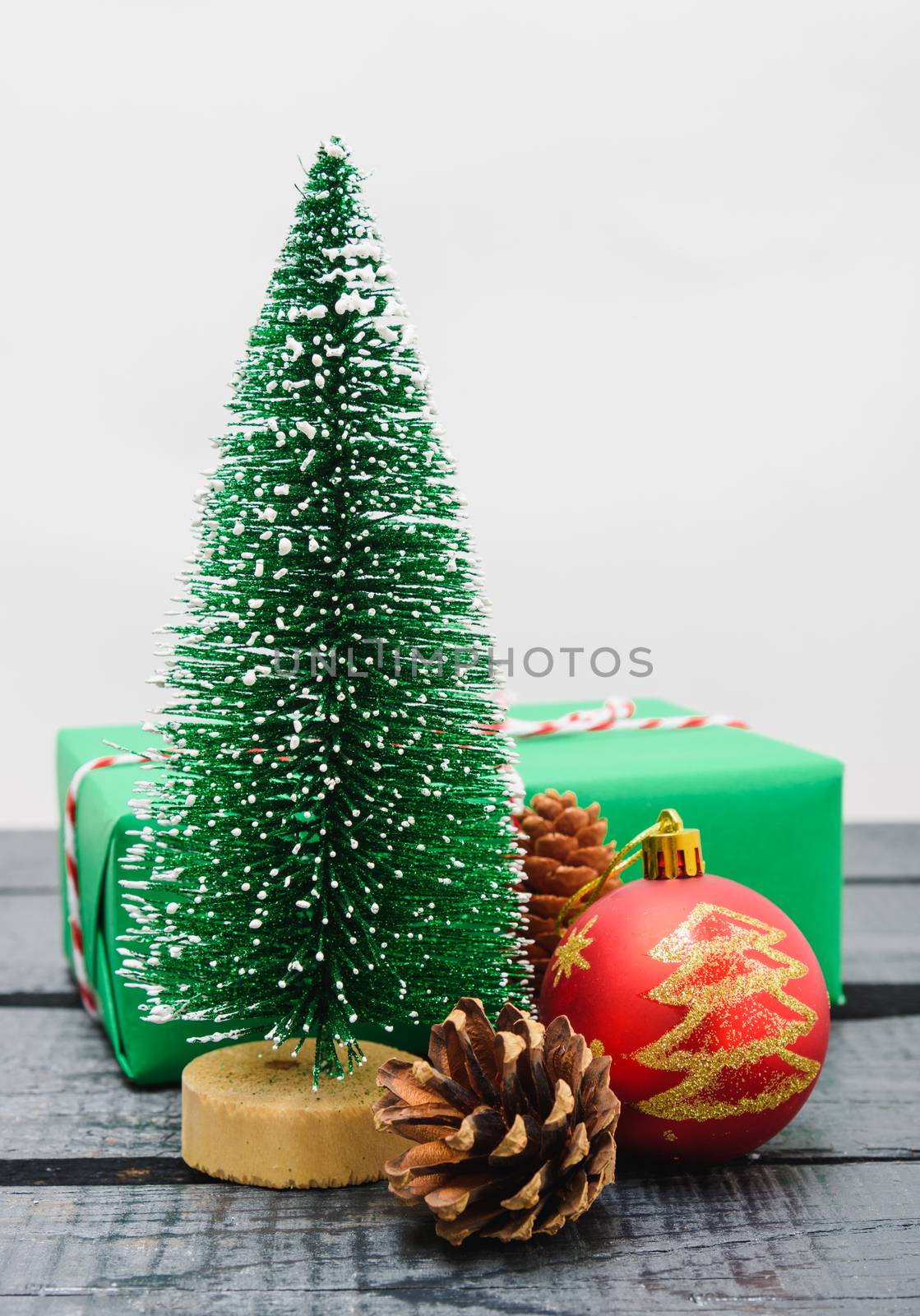 Christmas composition decorations, minimal green fir tree branches with snow on white background. Merry Christmas concept. Copy space for text