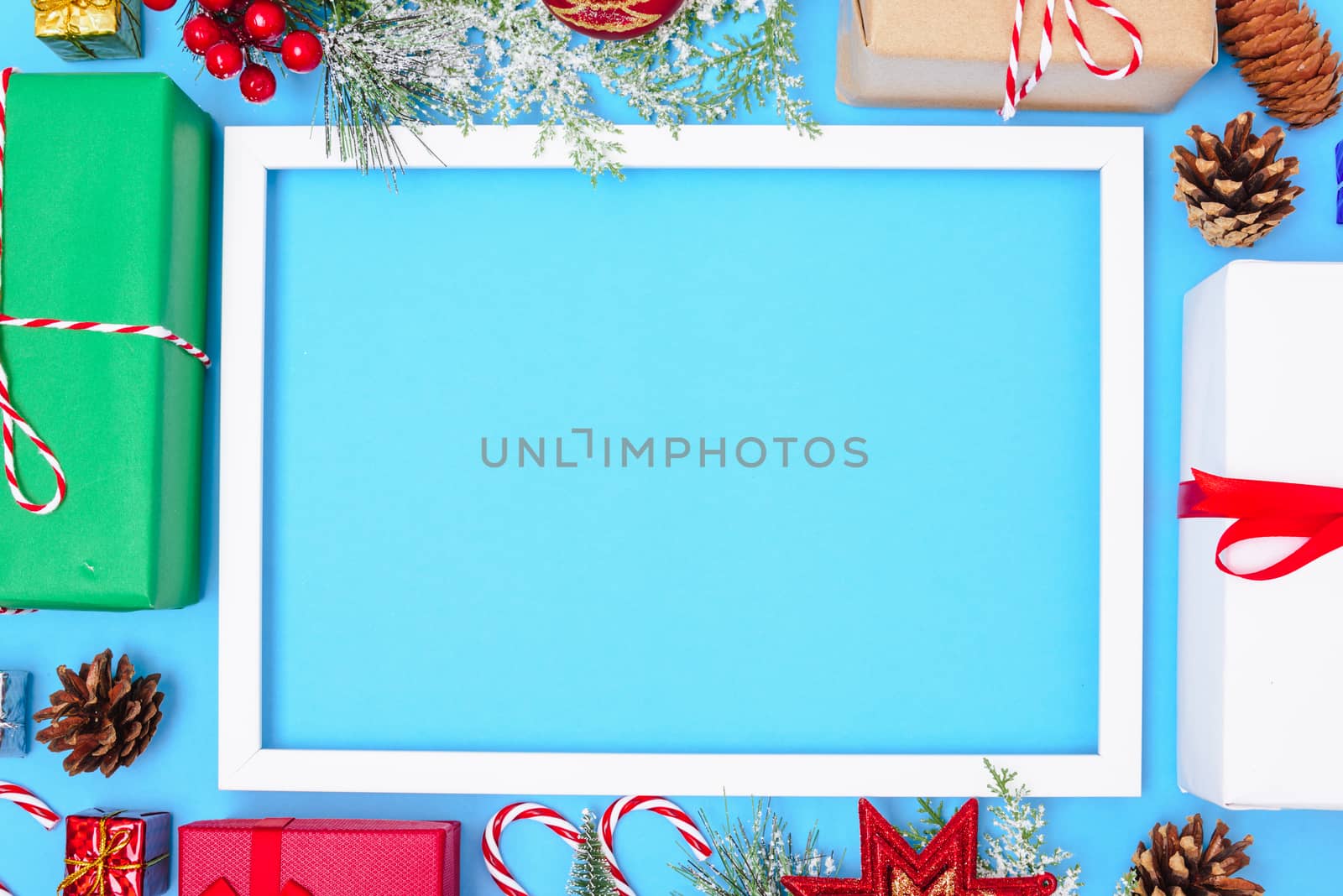Happy New Year and Christmas day 2020, top view composition decoration photo frame on blue background with copy space for your text