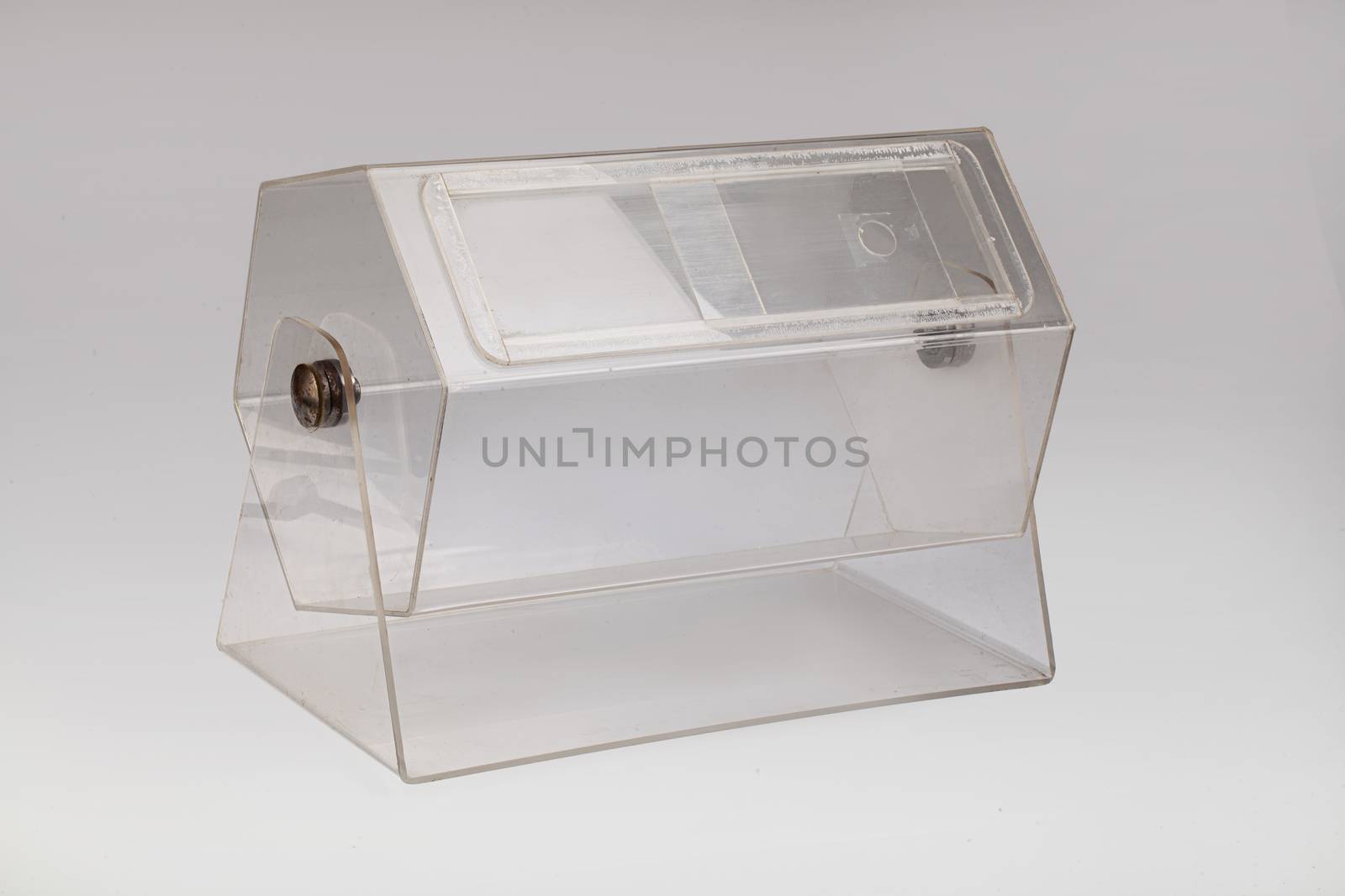 Transparent lottery drum on an isolated studio background