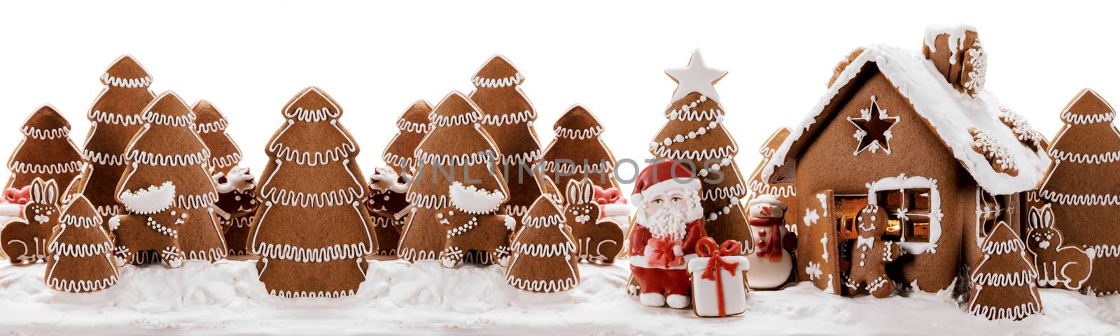 Gingerbread house christmas fir trees Santa Claus and gift cookies winter holiday celebration concept isolated on white background