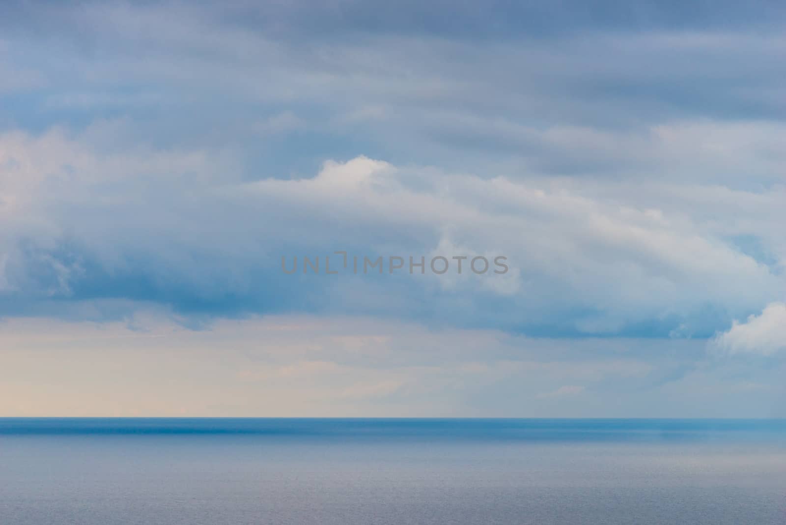 Clouds over the sea, background seascape before the rain