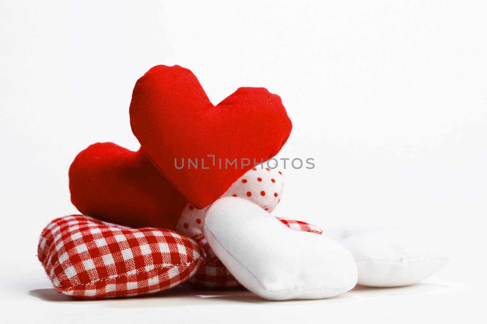 Textile red hearts isolated on white background