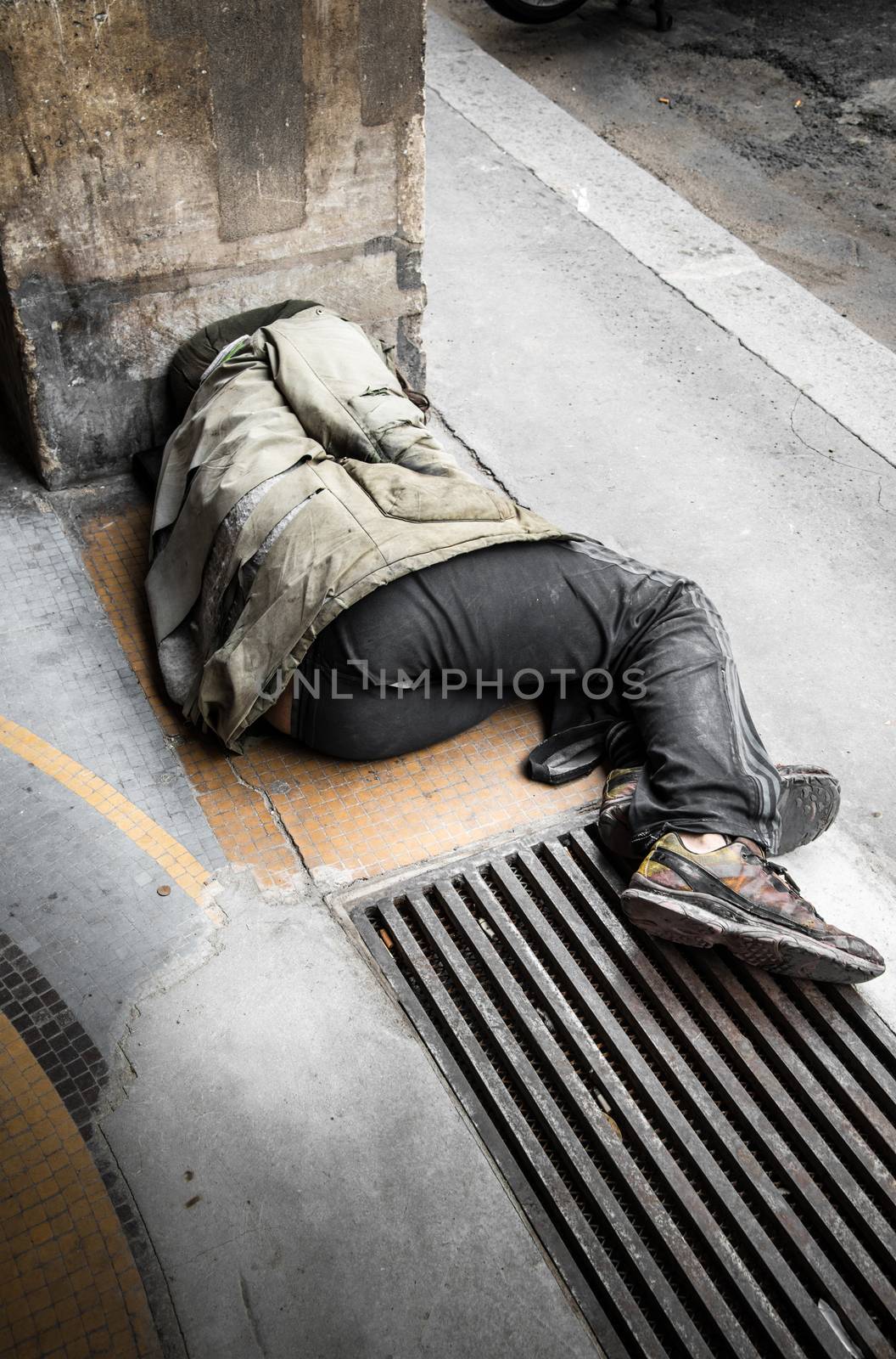 a Beggar sleeping on the ground