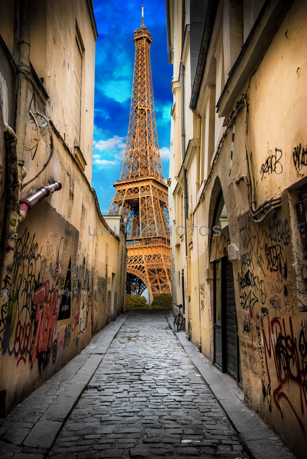 the Eiffel Tower from an alley by photobeps