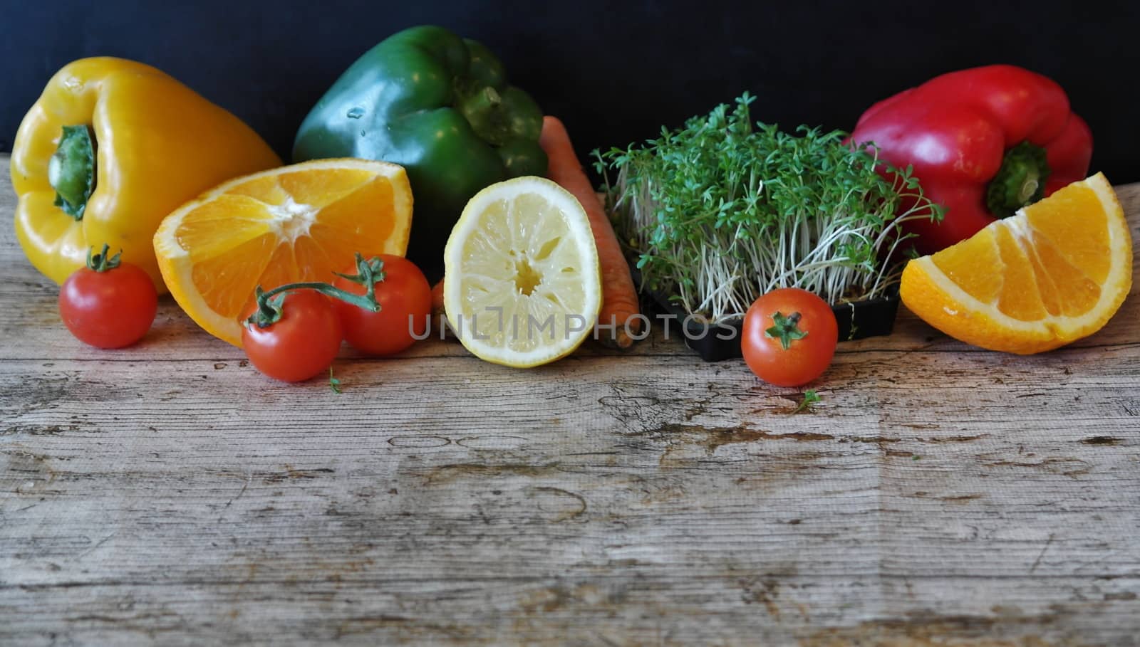 In images Fresh and colorful vegetables and fruits in a wooden crate