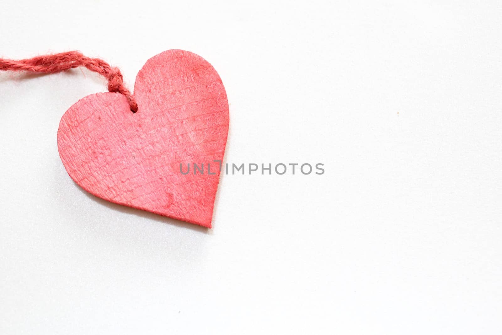 The picture shows a red heart on a white background