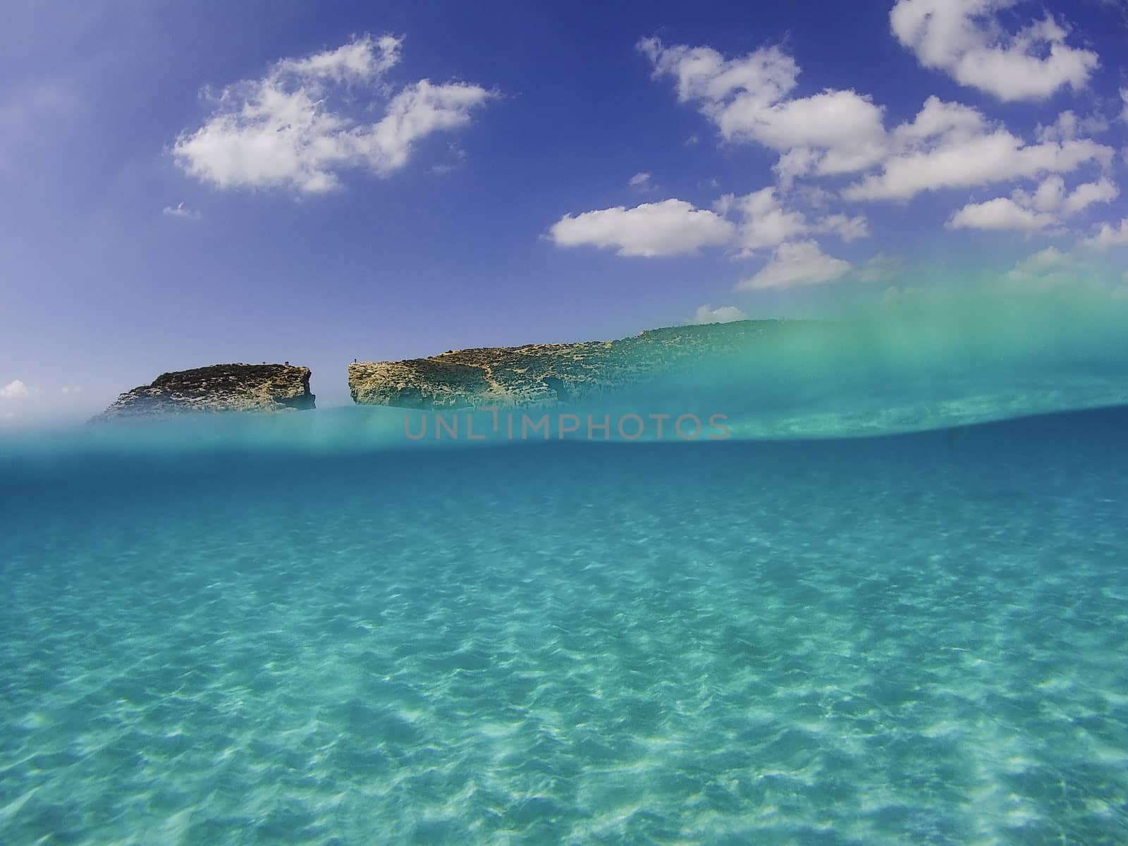 Half underwater photograph in the mediterranean sea near Malta, Comino, Blue Lagoon 2019