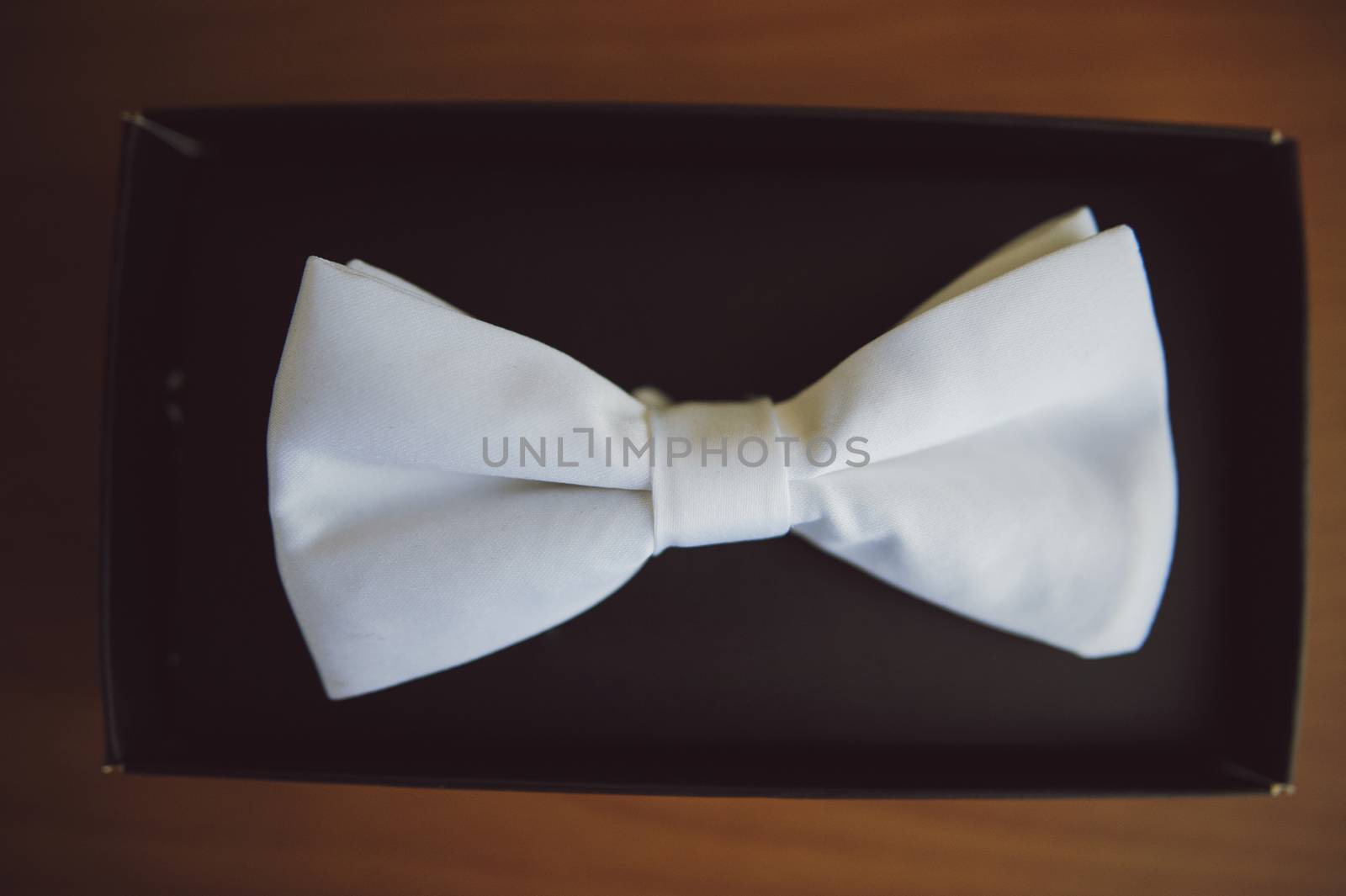 Groom's wedding accessories. Bow tie, suit, cufflinks, belt and shoes